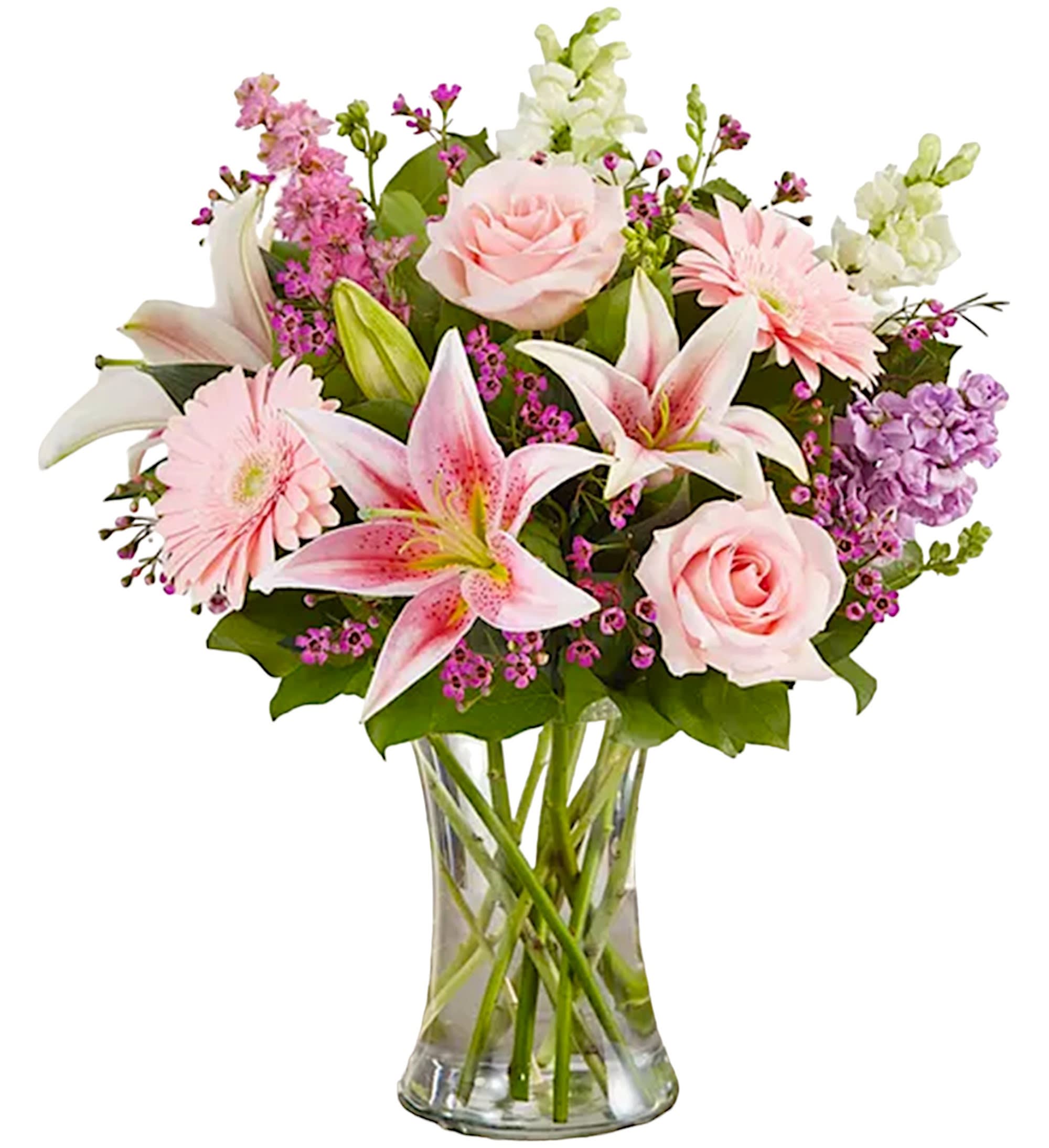 Pink and white mixed flowers arranged in a clear glass vase