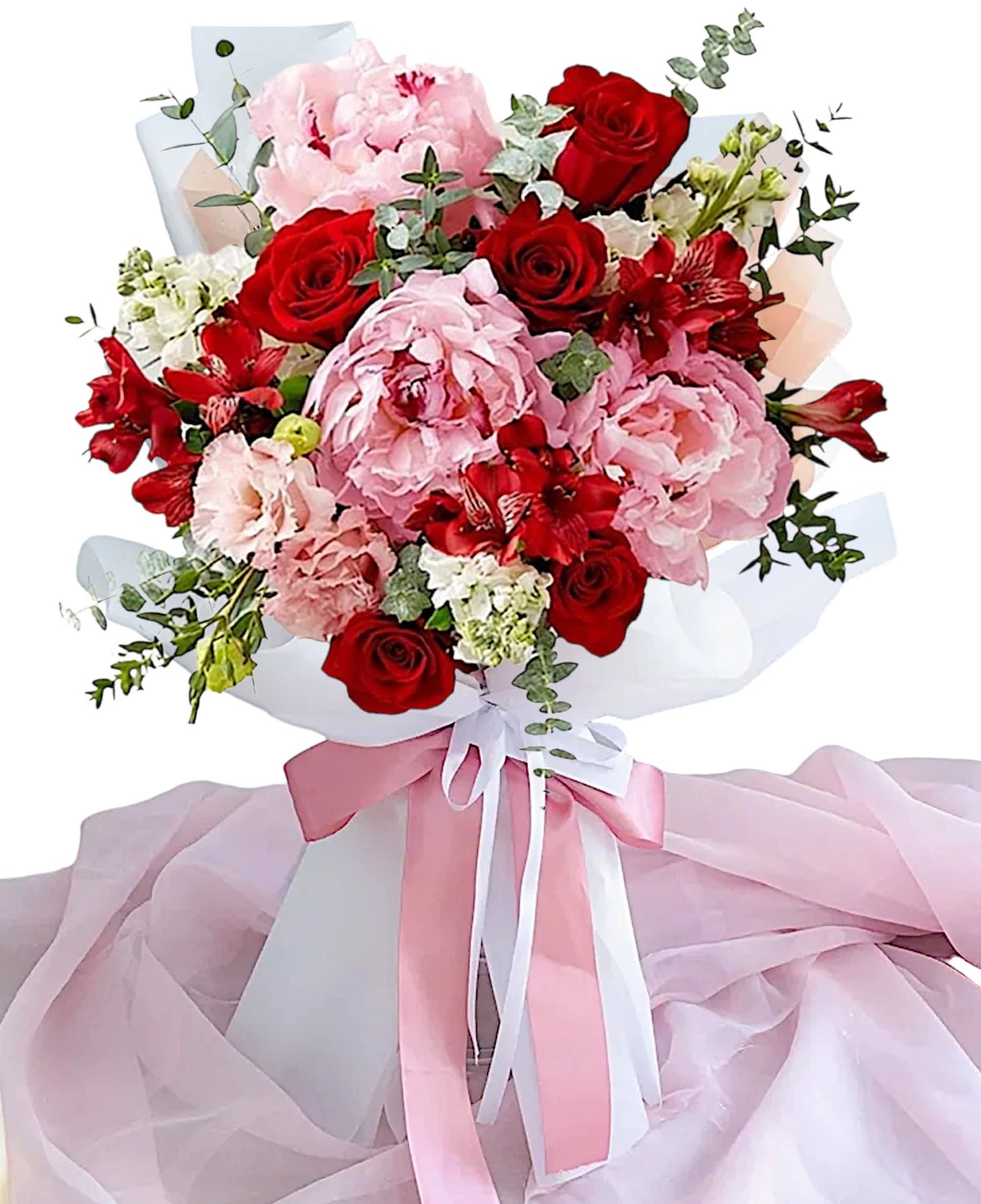 Bouquet of red roses and pink peonies wrapped with pink ribbon
