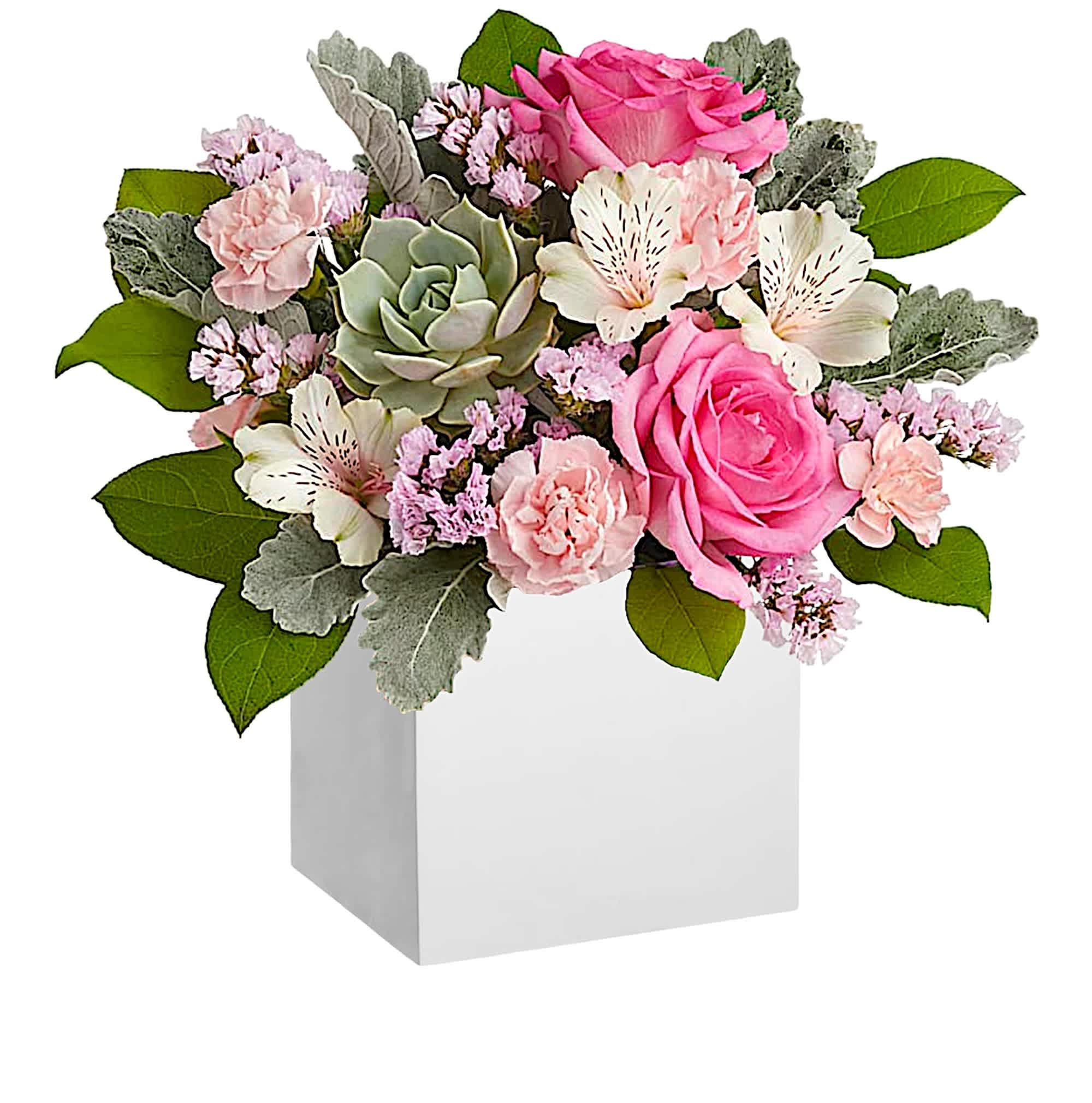 Pink and white floral arrangement in a white box with a succulent