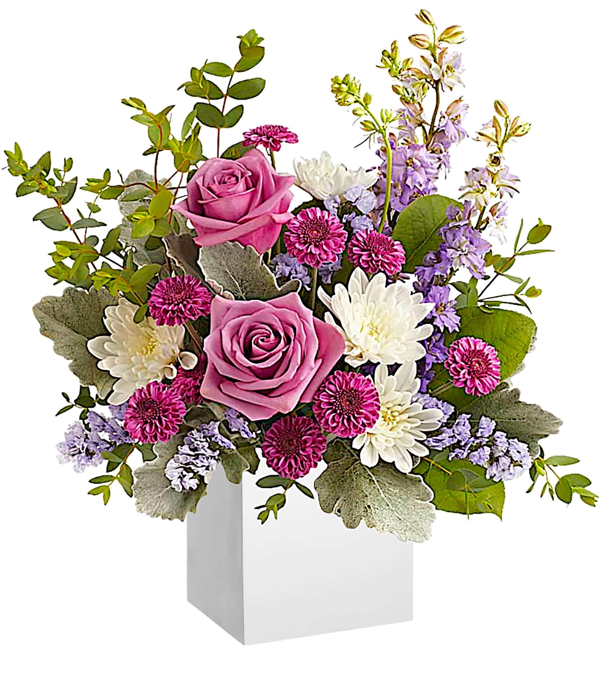 Pink roses and white daisies in a white box vase