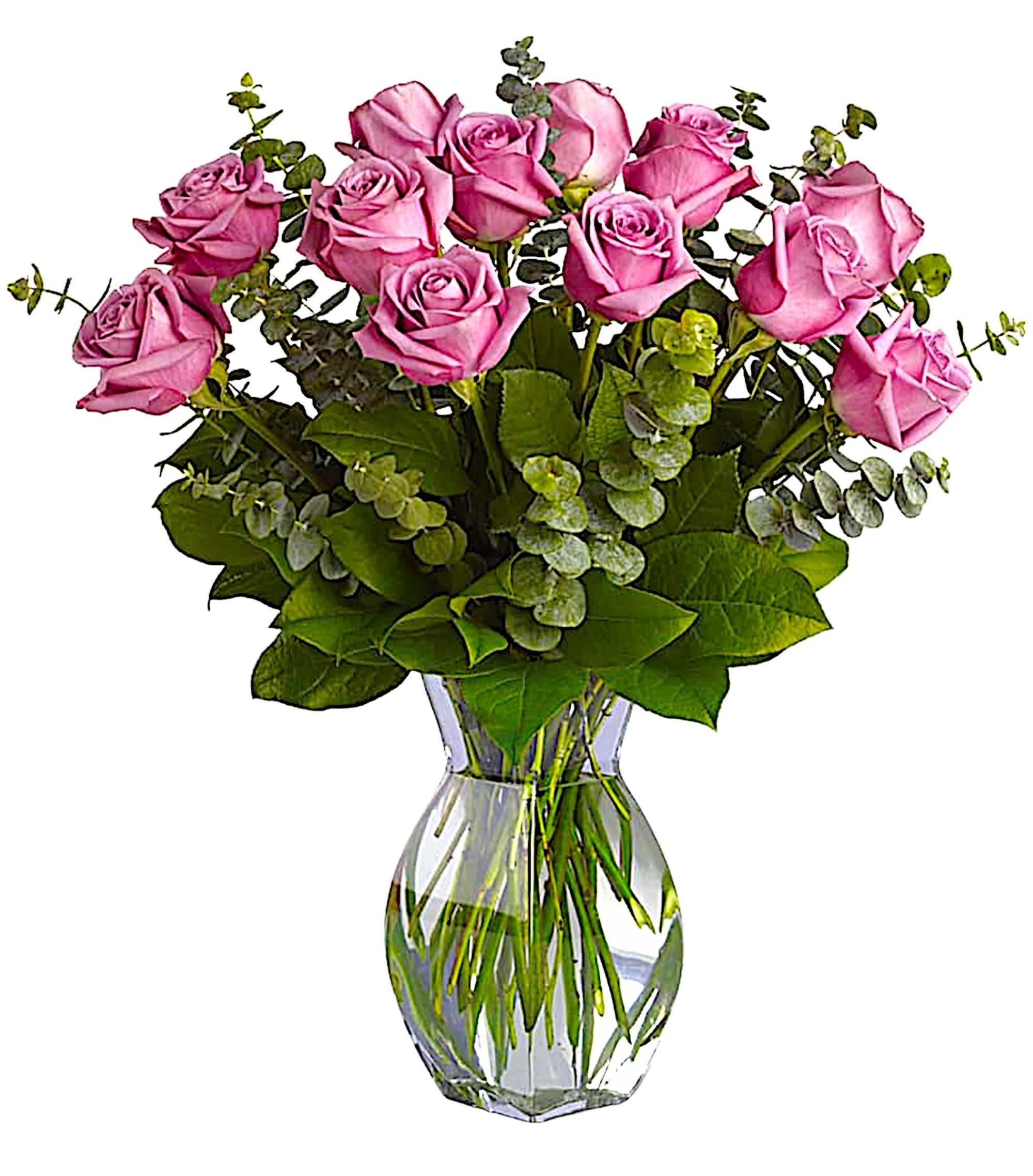 Pink roses arranged in a clear glass vase