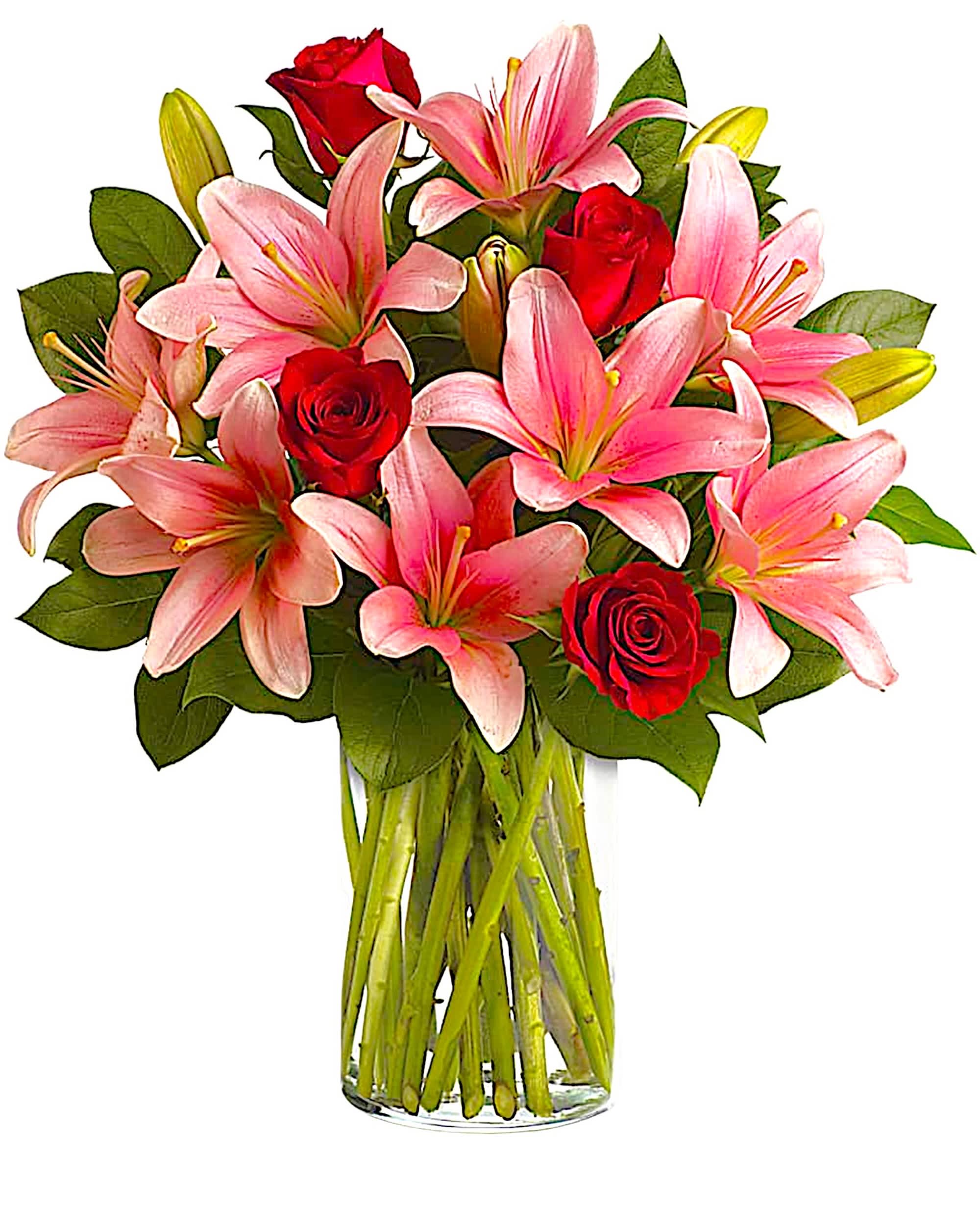 Pink lilies and red roses in a clear glass vase