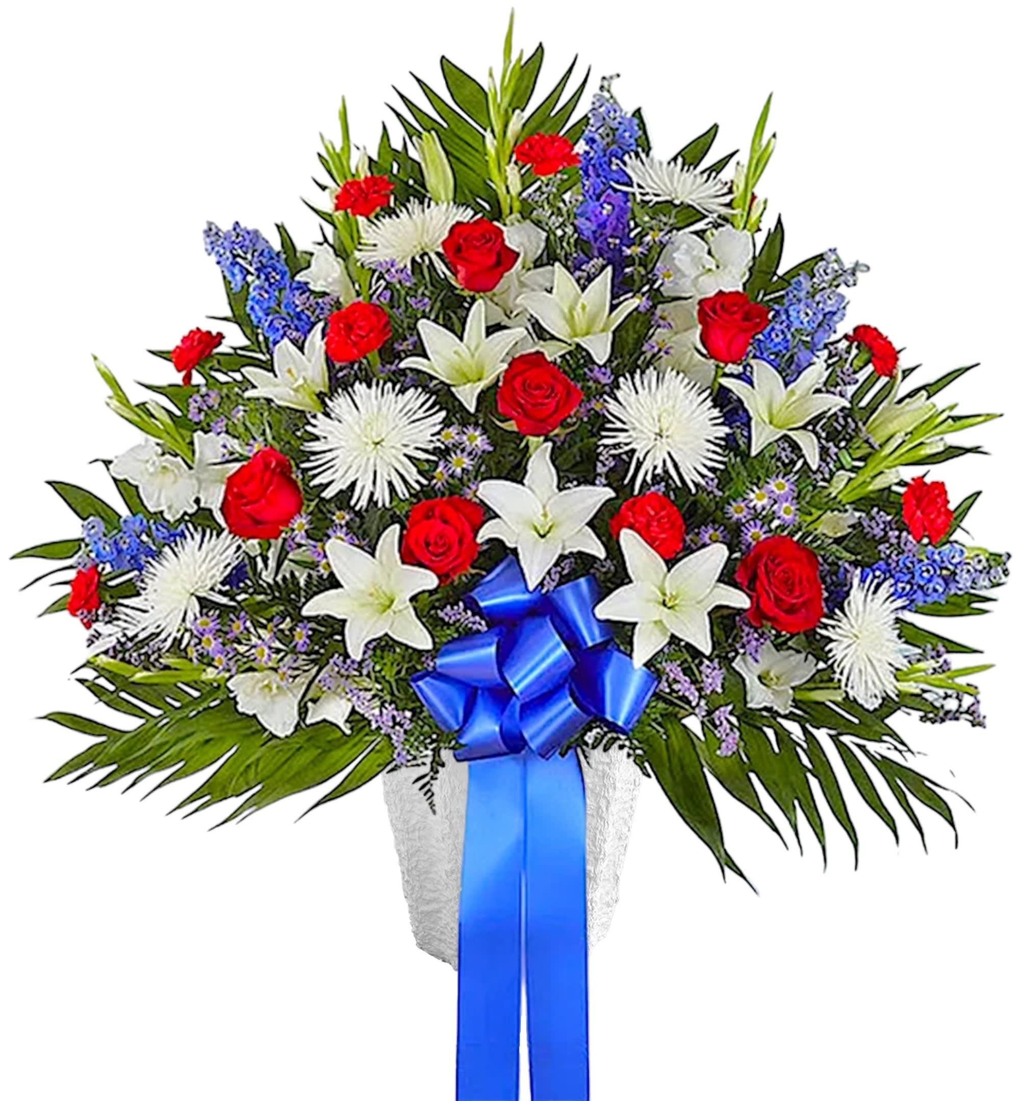 Large bouquet of red roses, white lilies, and blue flowers with a blue ribbon