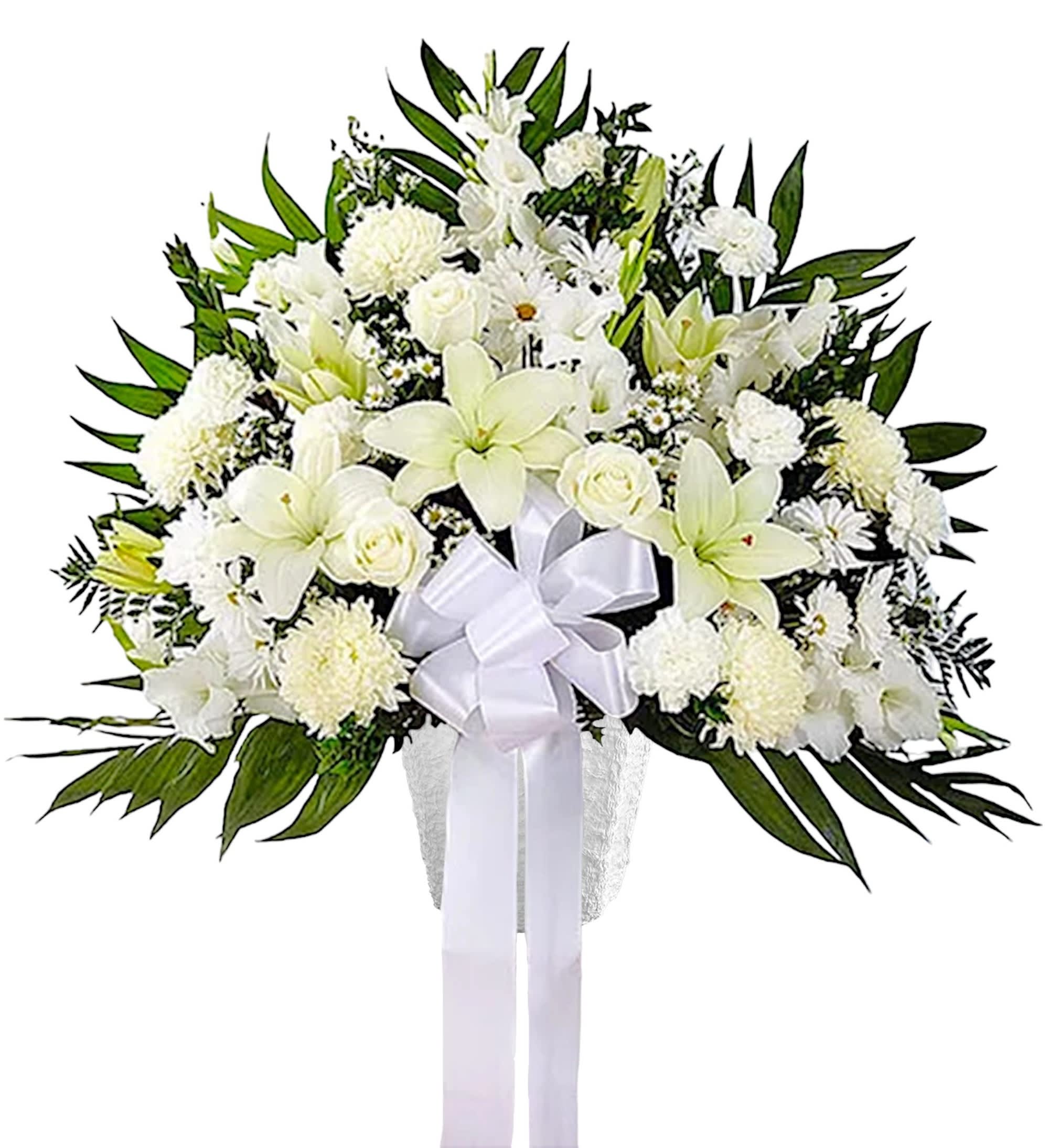 White funeral spray with lilies, roses, and a ribbon on a stand