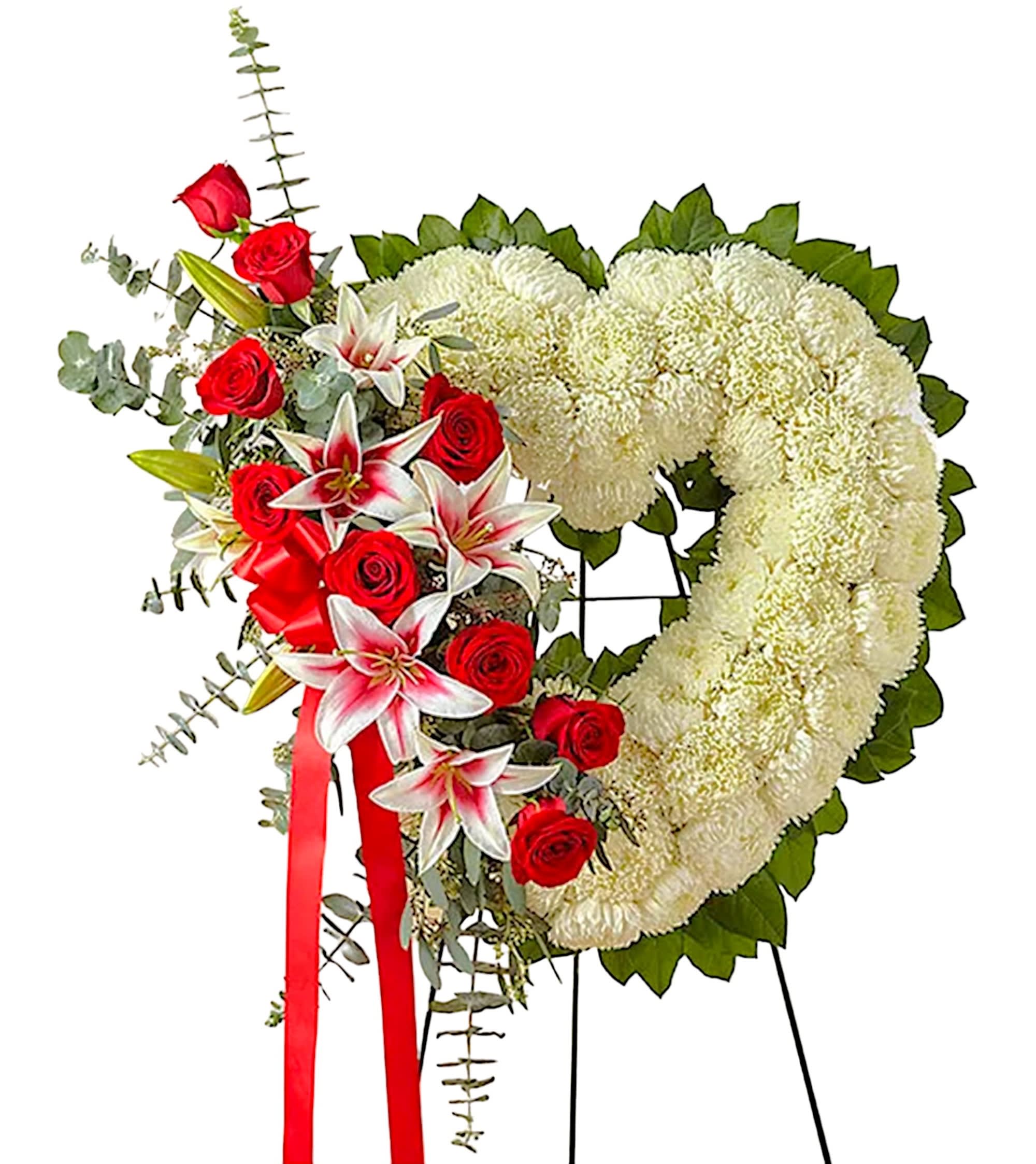Heart-shaped funeral wreath with white chrysanthemums and red roses