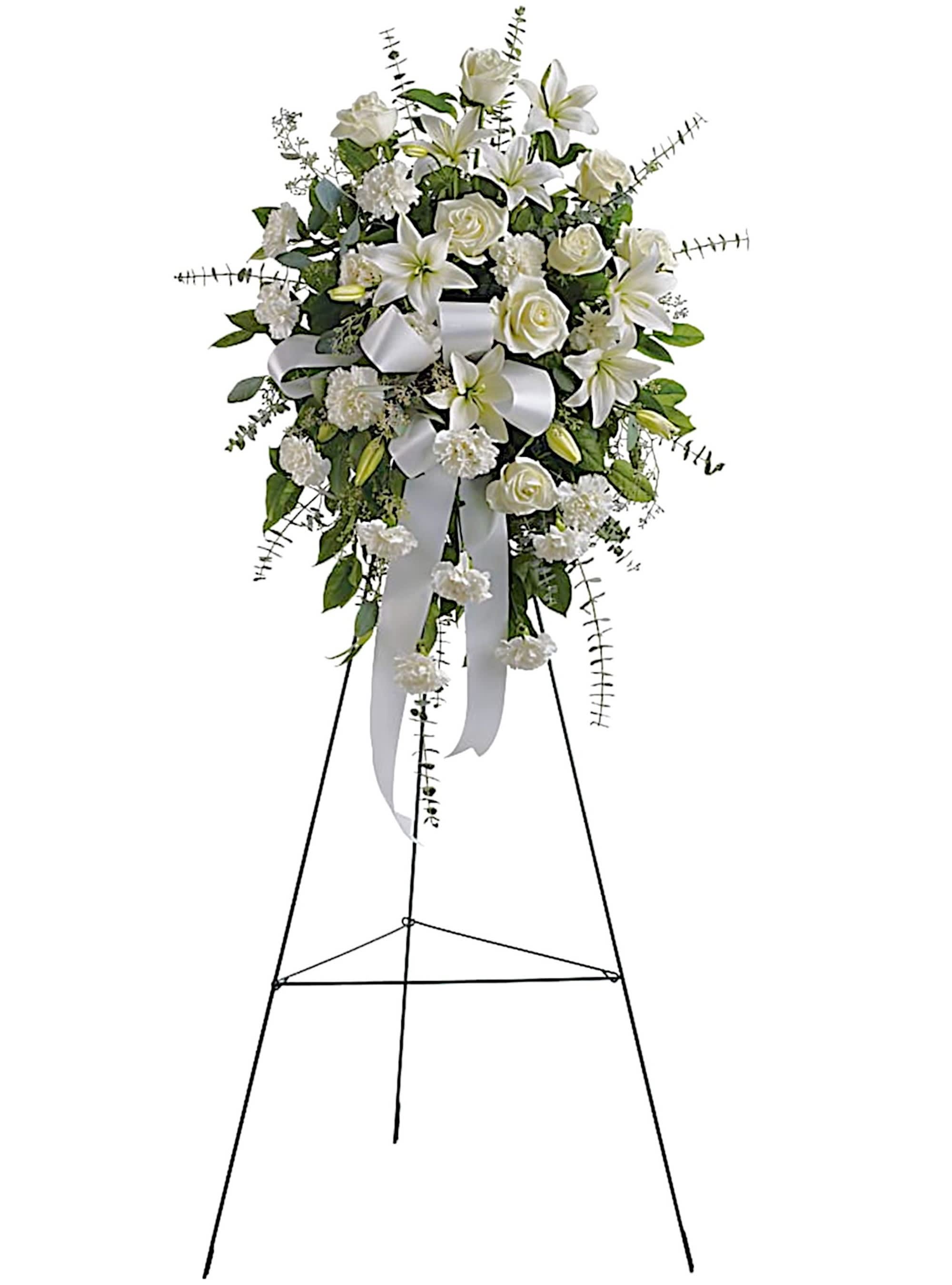 White floral standing spray on an easel with ribbon