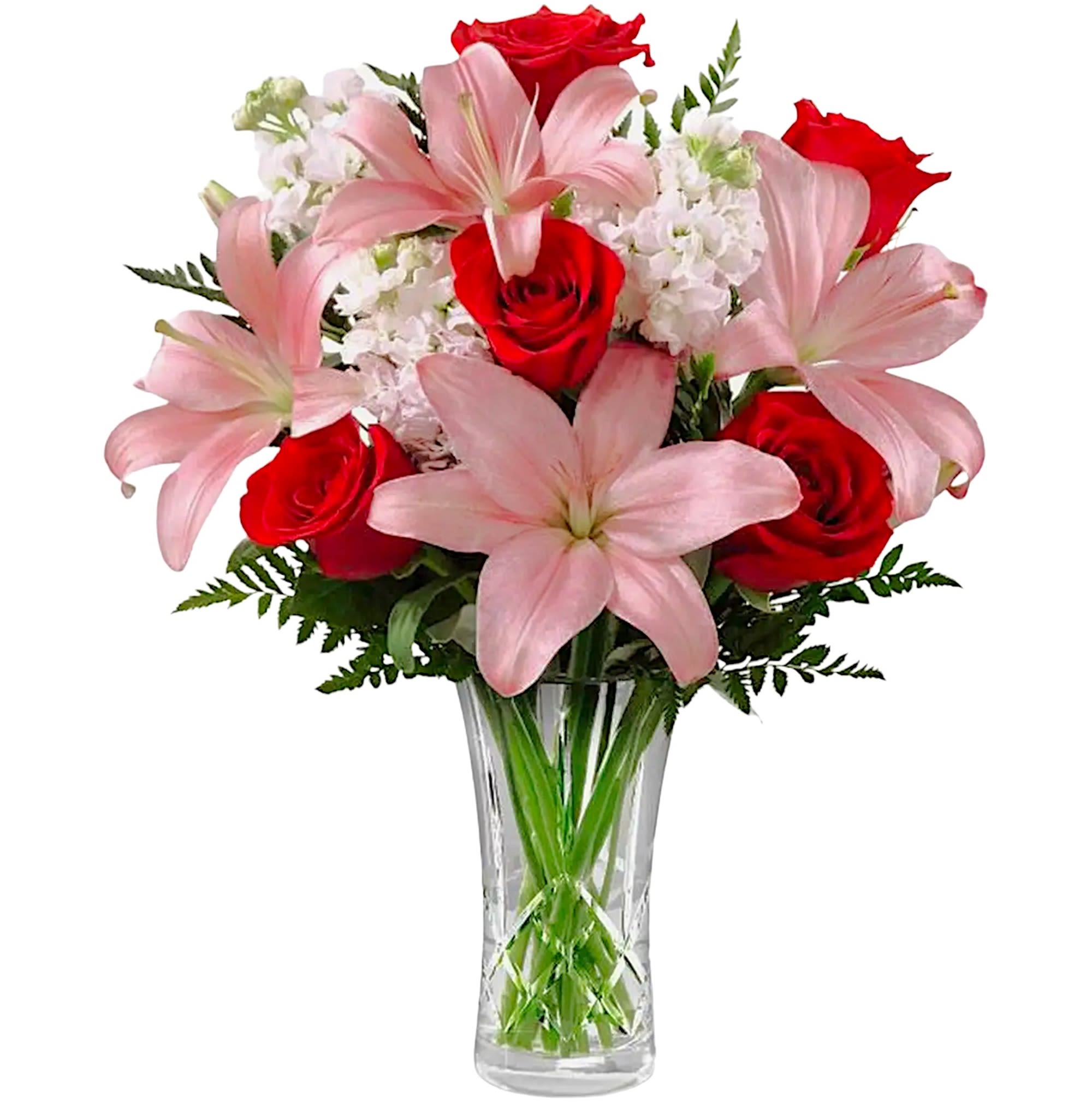 Bouquet of pink lilies and red roses in a clear glass vase