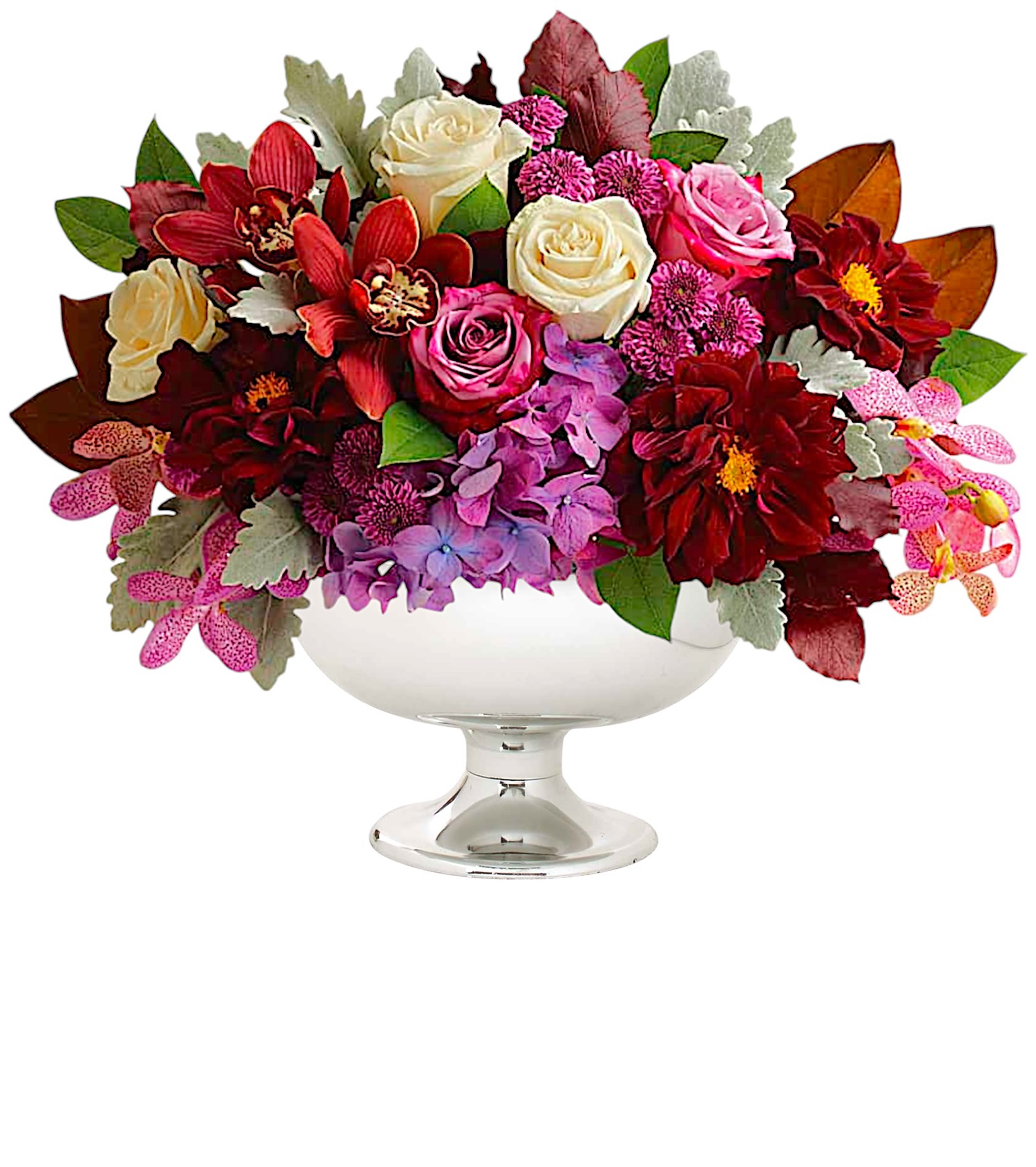 Mixed bouquet of roses and orchids in a white pedestal bowl