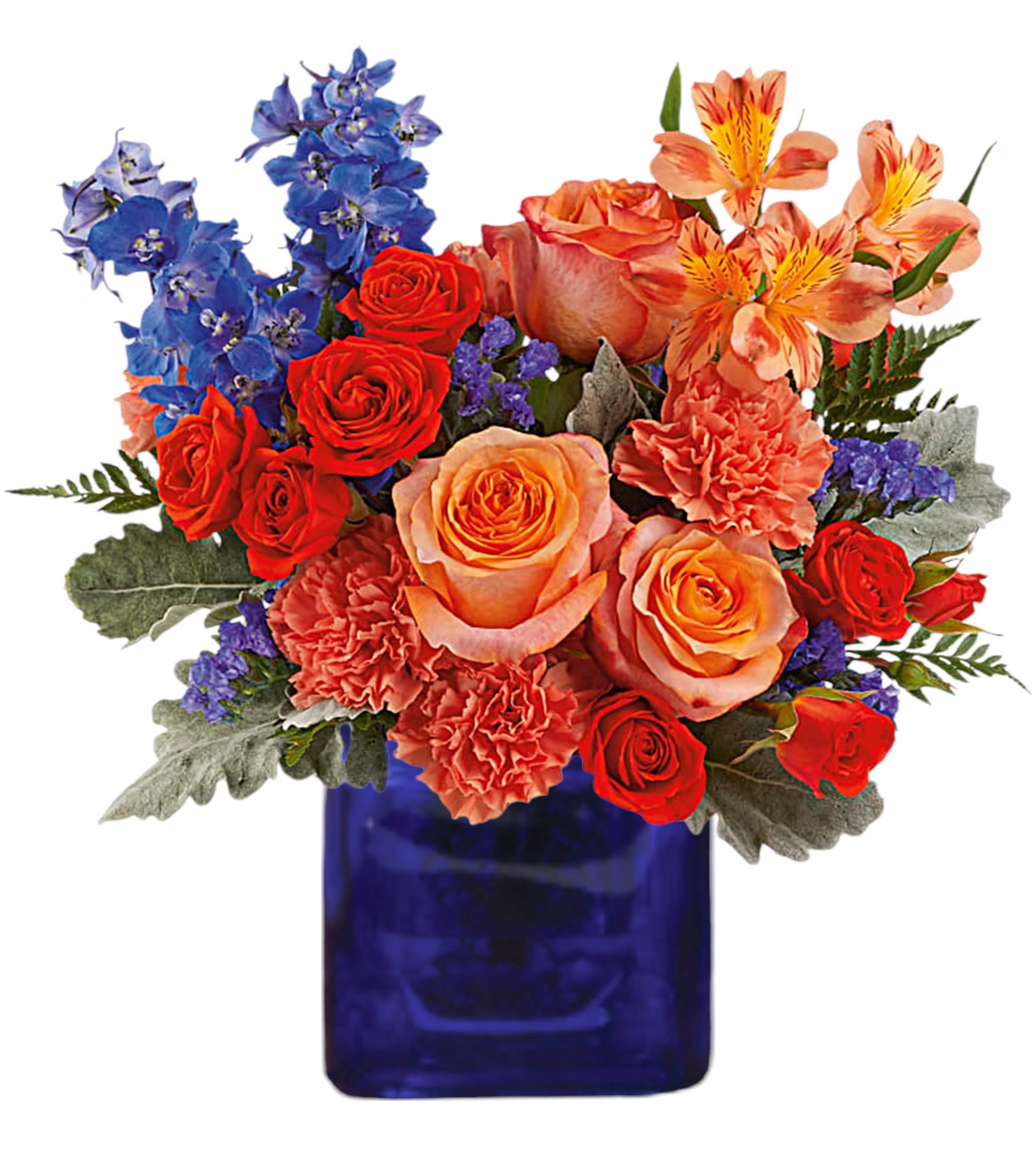 Blue Daydream - Oh so dreamy! Turn any day into a party with this amazing orange rose arrangement, beautifully contrasted in a blue glass cube vase.  DETAILS Orange roses, dark orange spray roses, orange alstroemeria, orange carnations, blue delphinium and blue sinuata statice are arranged with dusty miller and leatherleaf fern.  VASE INCLUDED Orientation: All-Around Item #NF-168  FLORIST-TO-DOOR Same day flower delivery on most orders placed by 12 pm or 10 am on weekends PST.  BLOOM DETAILS Roses Spray Roses Alstroemerias Carnations Delphinium Statice Filler Greenery  The Standard Arrangement is approx. 13" H x 13 1/4" W. The Deluxe Arrangement is approx. 13 1/2" H x 13" W. The Premium Arrangement is approx. 13 1/2" H x 13"W.  How to place an order?  1. You can place an order directly on this secure website. 2. You can call in your order by dialing: (323) 262 - 9238 3. You can visit our store (appointment recommended 323.262.9238)  NINFA'S FLOWERS 2405 WHITTIER BLVD. LOS ANGELES, CA. 90023  ATTENTION: *Please note that on busy holidays, Valentine's Day, and Mother's Day, we cannot verify if the recipient received the flowers until the following day. You can verify delivery on the website after 10:00 pm, call 323.262.9238 the following day after 10:00 am, or contact the recipient directly. Thank you for your patience and understanding.