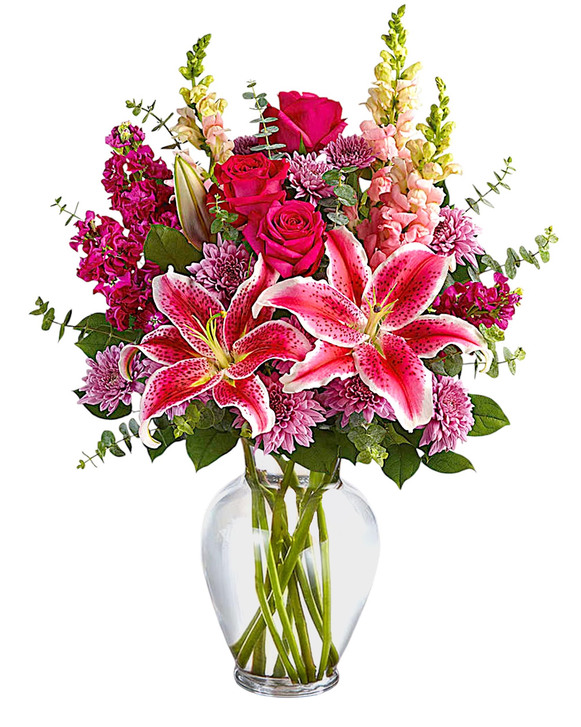 Pink lilies and roses in a clear glass vase