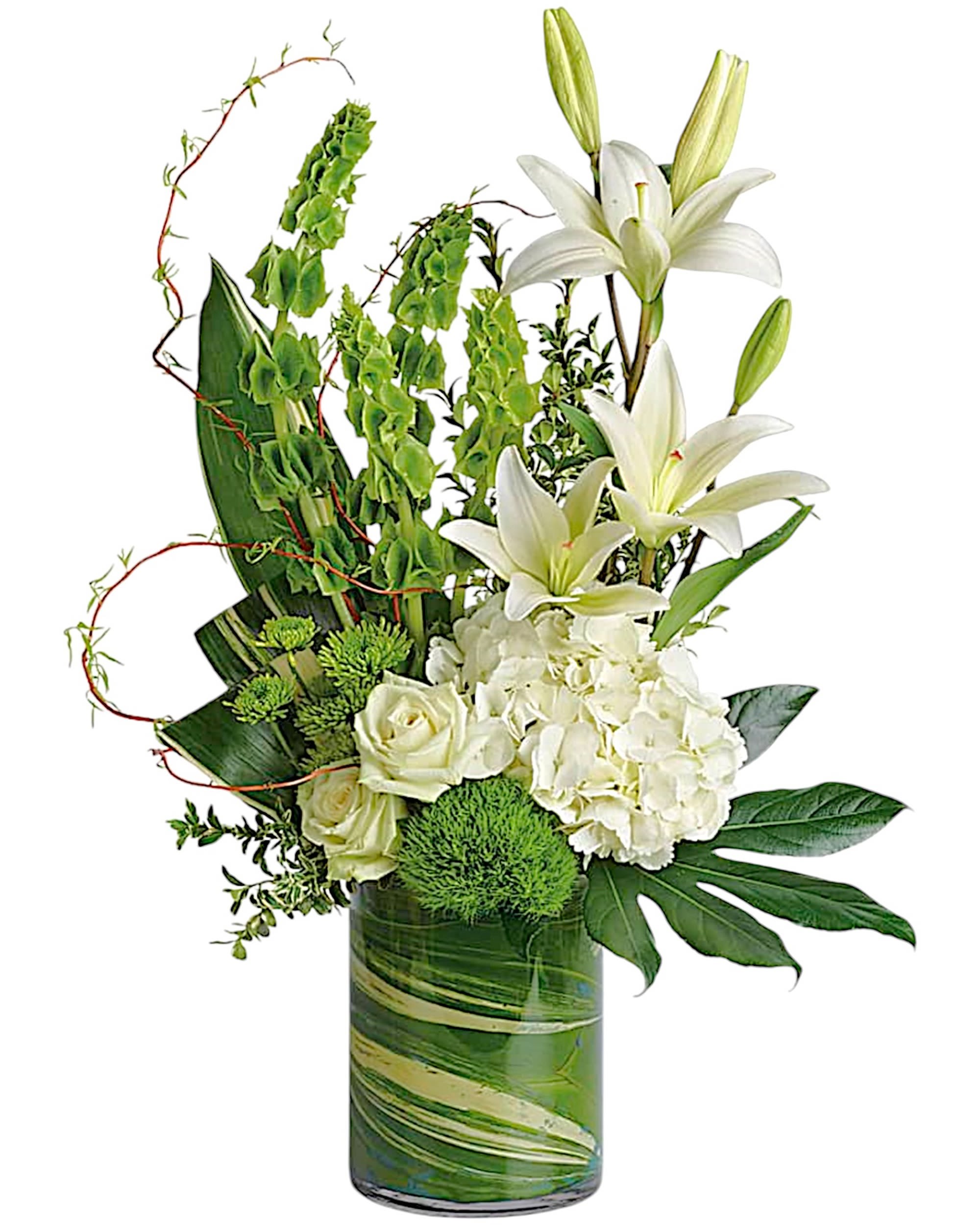 White lilies and roses in a green glass vase with green accents
