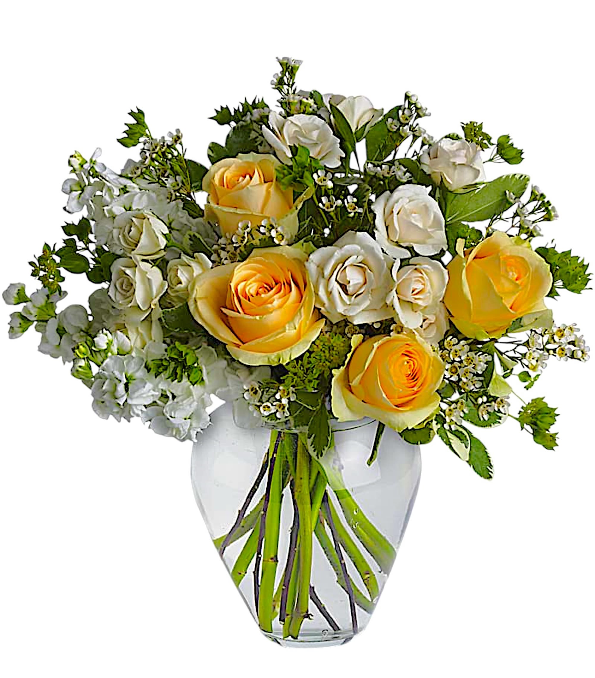 Yellow and white roses arranged in a clear glass vase