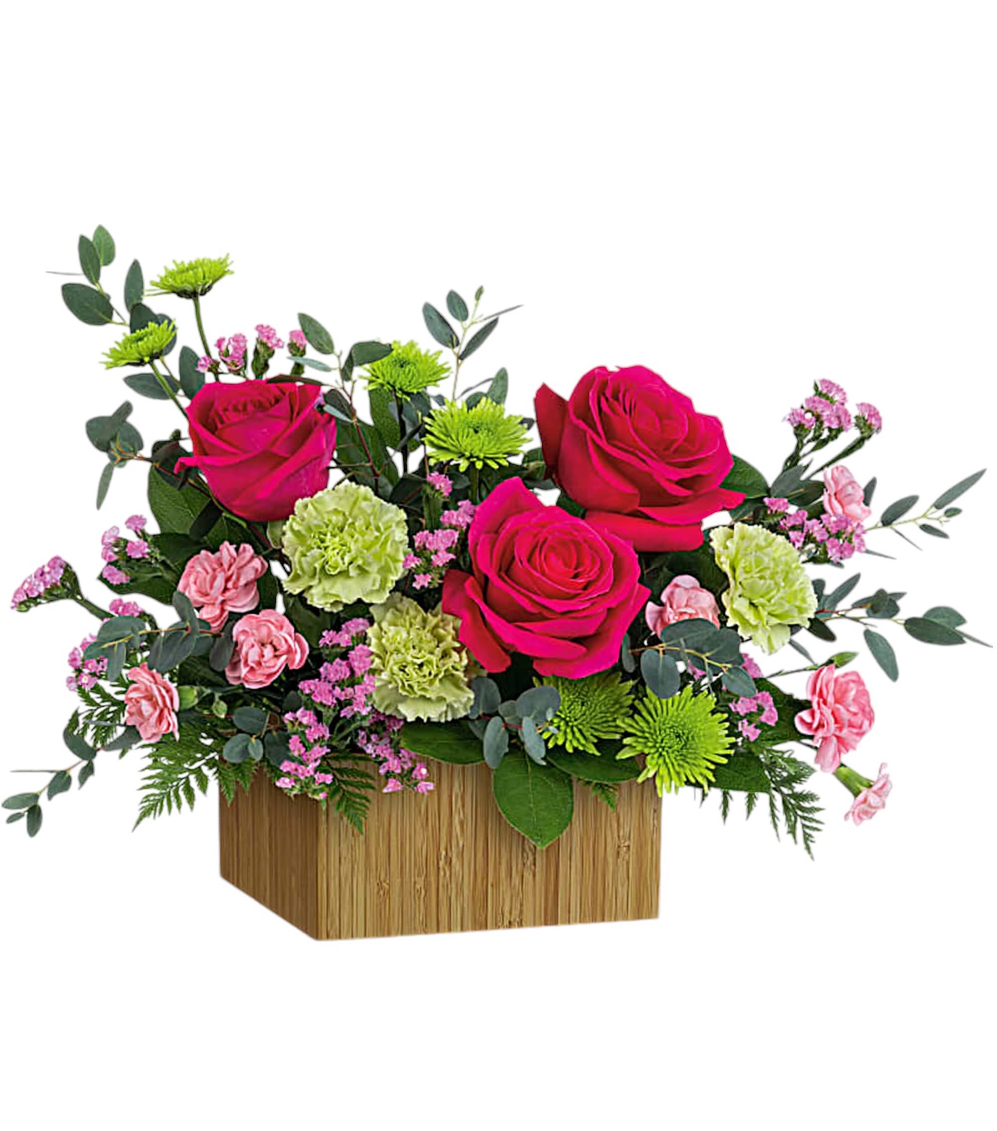 Pink roses and carnations in a wooden box with green accents