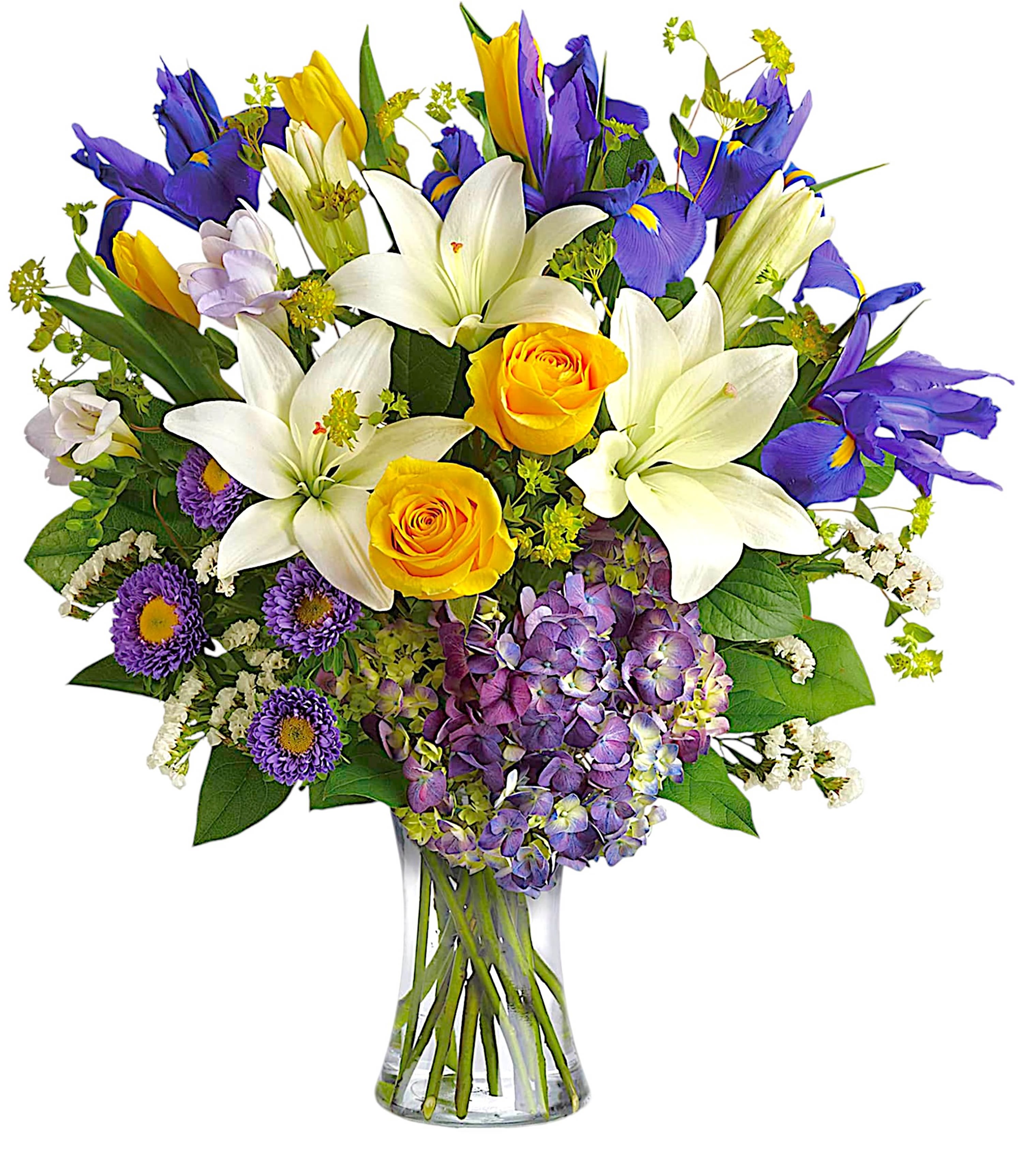 Bouquet of white lilies, yellow roses, and purple flowers in a glass vase