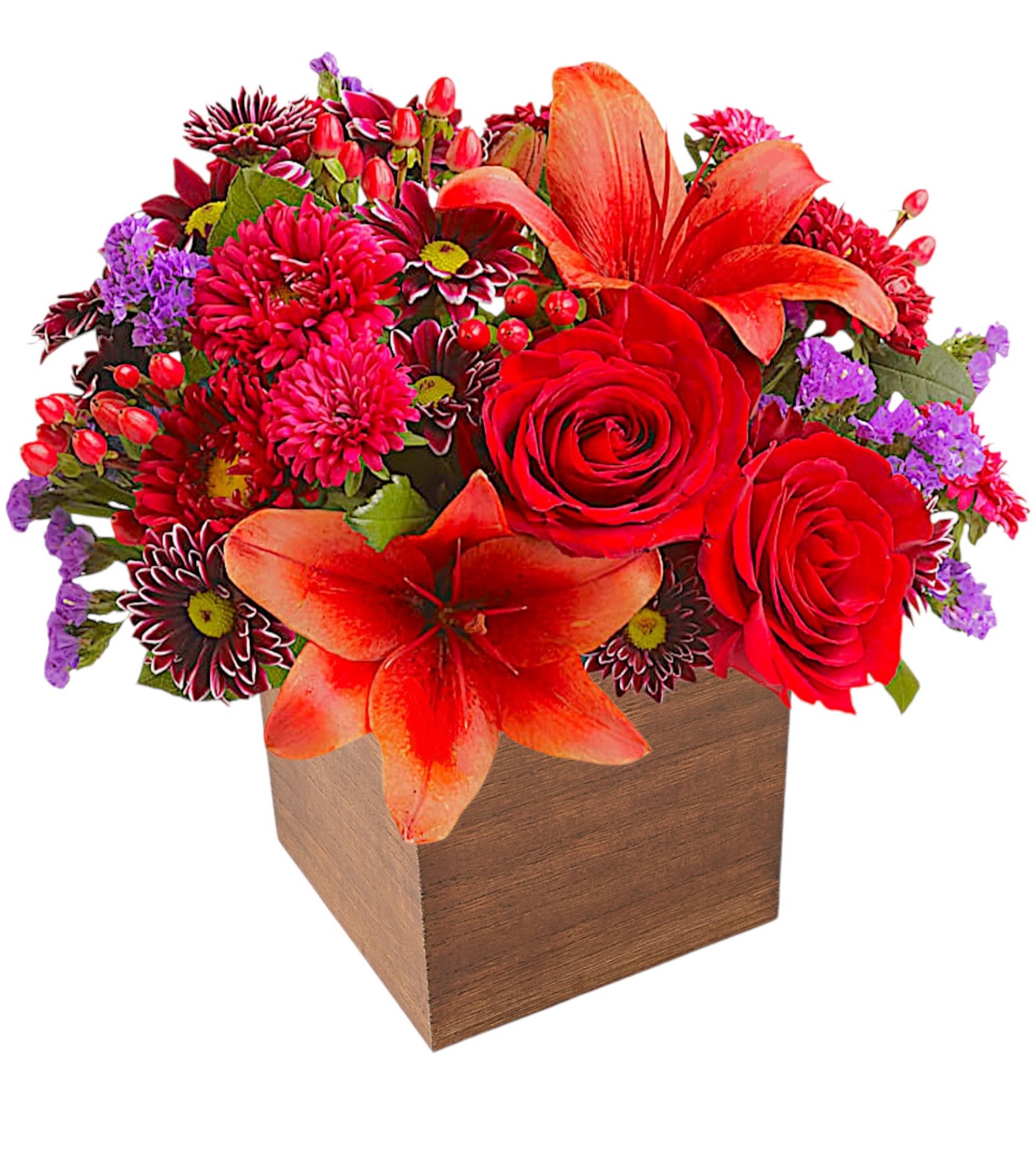 Red and orange floral arrangement in a wooden cube vase