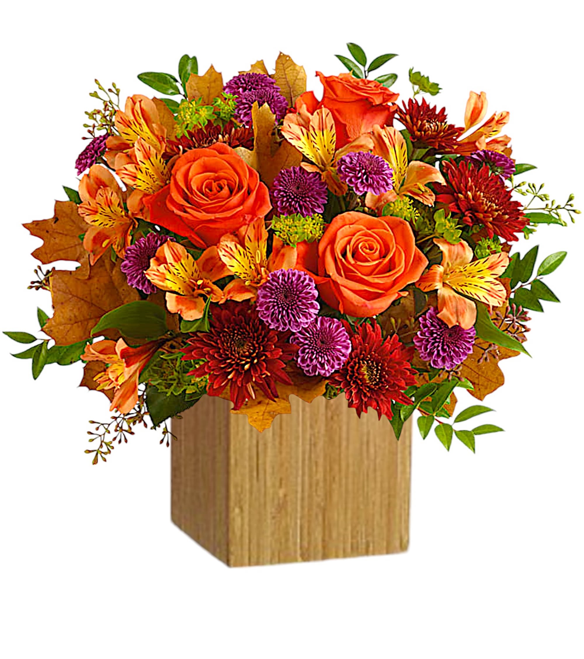 Orange roses and mixed fall flowers in a wooden cube vase