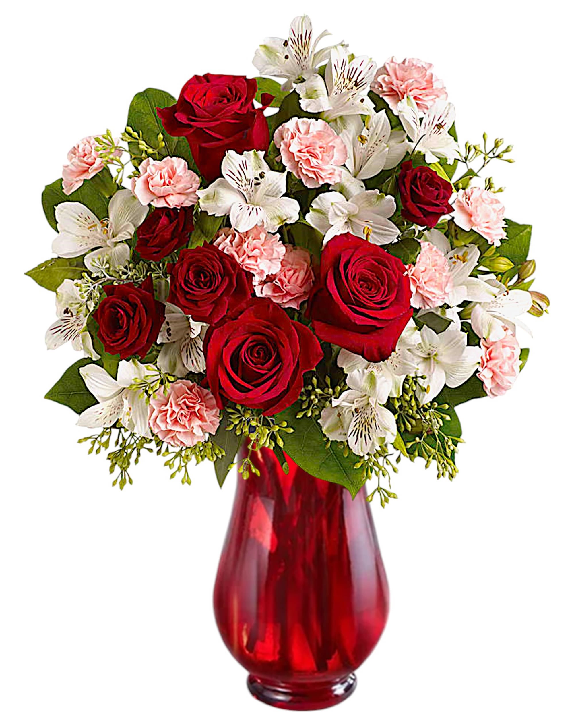 Red roses, white lilies, and pink carnations in a red glass vase