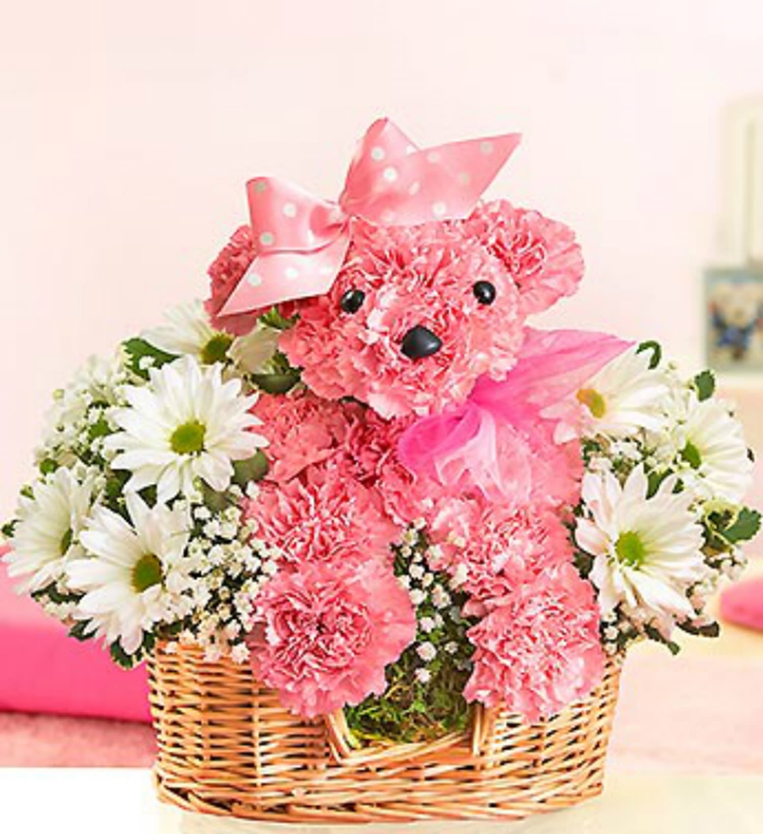 Princess Paws Poodle - Add a little princess power to their day with our perfectly pink Princess Paws Poodle arrangement. Hand-crafted arrangement of pink carnations, daisy poms, baby's breath and variegated pittosporum. Arranged in the shape of an adorable dog, complete with eyes, nose and a pretty pink ribbon.  DETAILS Crafted from pink carnations, with sweet white daisy-mum blooms all around, this canine creation is designed in a basket.  BASKET INCLUDED Orientation: All-Around Item #NF-458  FLORIST-TO-DOOR Same day flower delivery on most orders placed online by 12 pm or 10 am on weekends PST.  BLOOM DETAILS Carnations Daisy-Mums Baby's Breath Filler Greenery  The Standard Arrangement is approximately 11.5" H x 5" W. The Deluxe Arrangement is approximately 11.5" H x 5" W.  The Premium Arrangement is approximately 11.5" H x 5" W.  How to place an order? 1. You can place an order directly on this secure website OR 2. You can call in your order by dialing: (323) 262 - 9238 OR 3. You can visit our store (appointment recommended 323.262.9238)  NINFA'S FLOWERS 2405 WHITTIER BLVD. LOS ANGELES, CA. 90023  ATTENTION: *Please note that on busy holidays, Valentine's Day, and Mother's Day, we cannot verify if the recipient received the flowers until the following day. You can verify delivery on the website after 10:00 pm, call 323.262.9238 the following day after 10:00 am, or contact the recipient directly. Thank you for your patience and understanding.