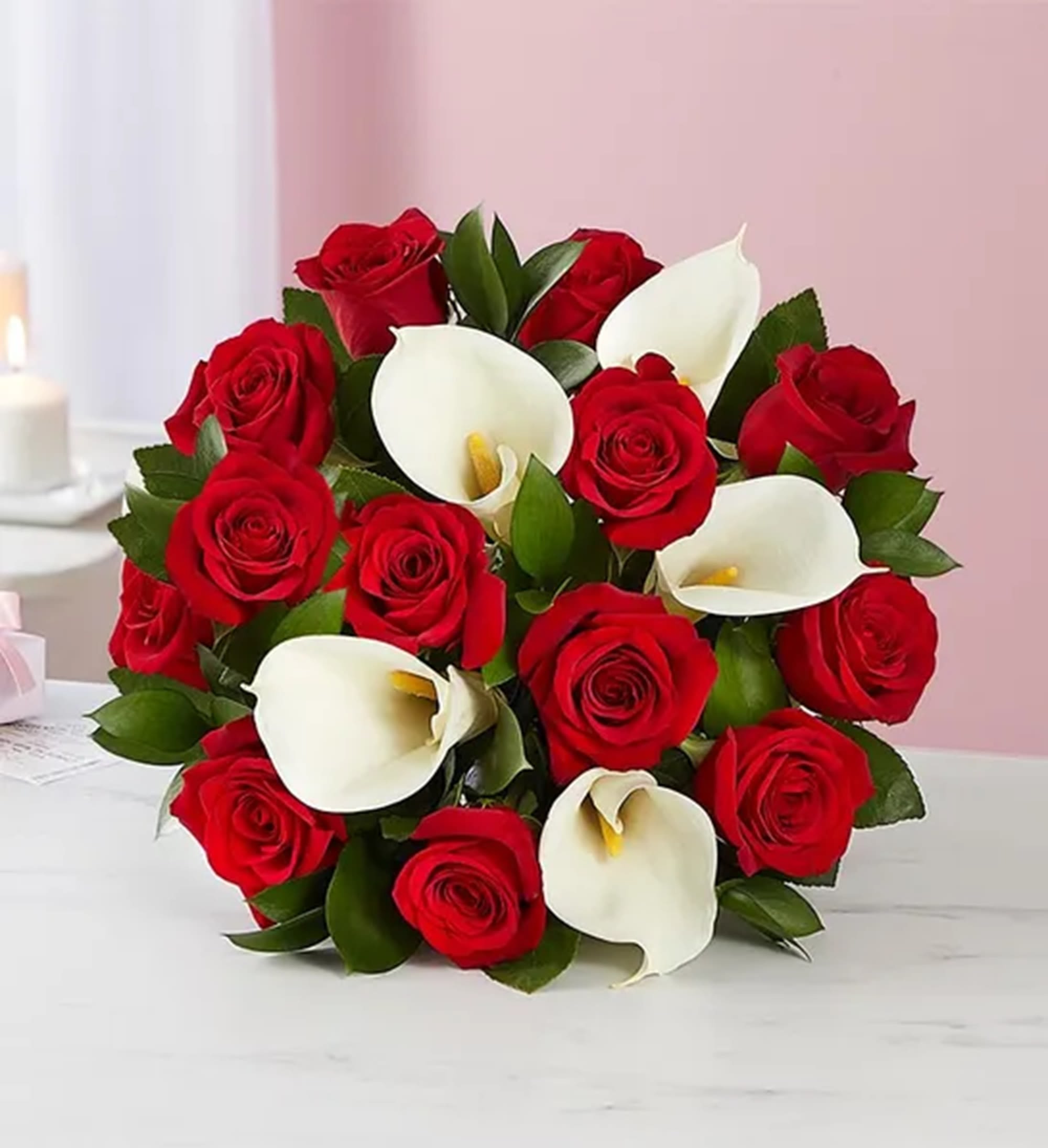 Bouquet of red roses and white calla lilies