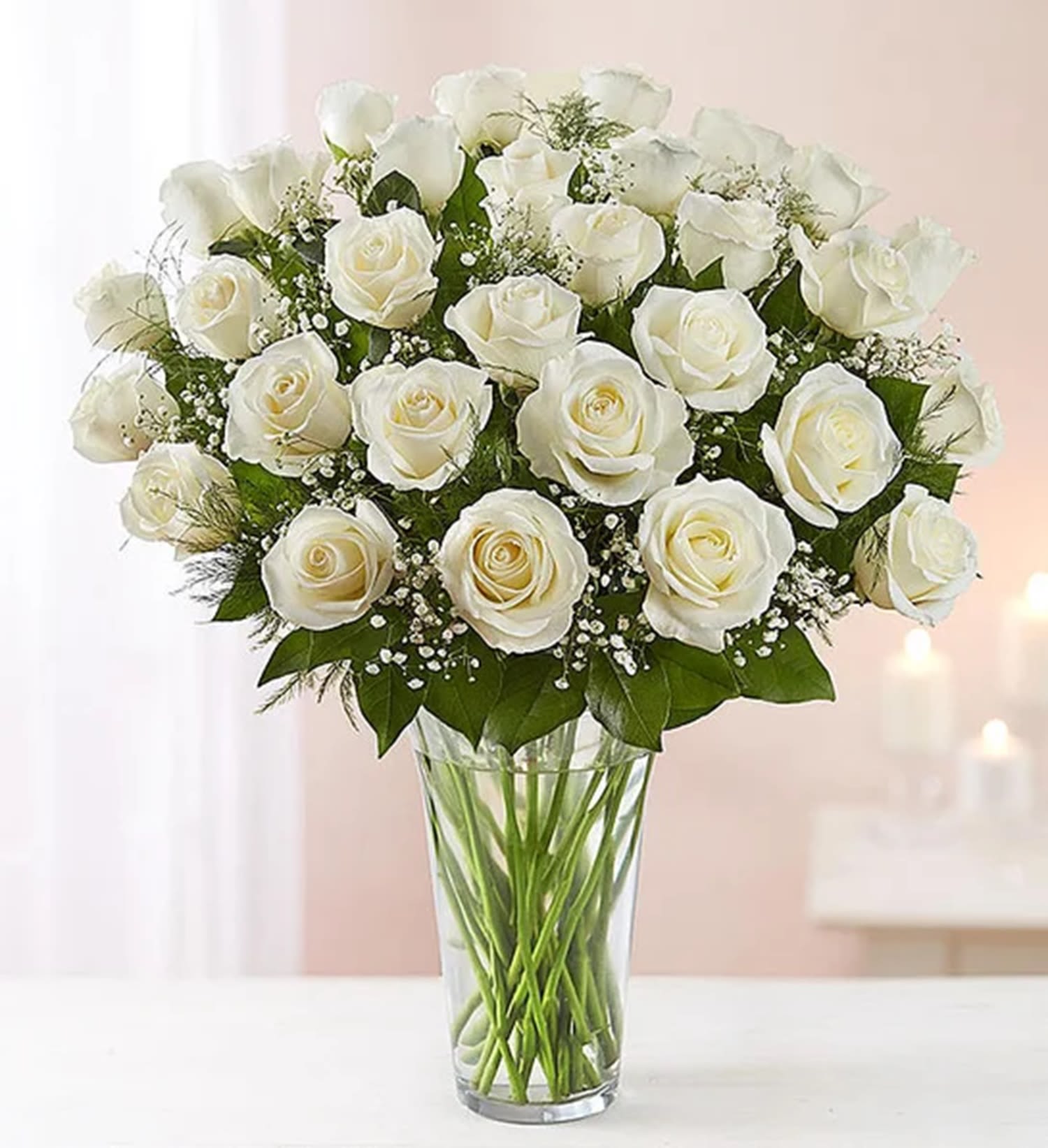 Bouquet of white roses in a clear glass vase