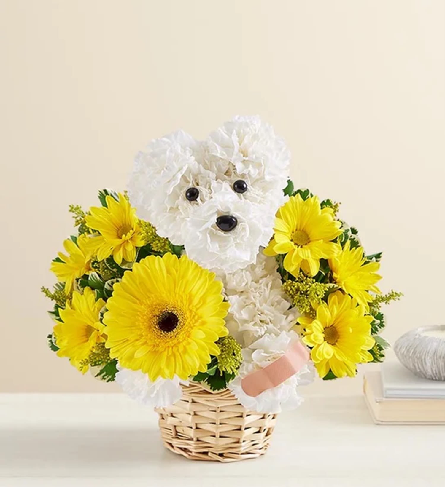 White flower dog in a basket surrounded by yellow daisies