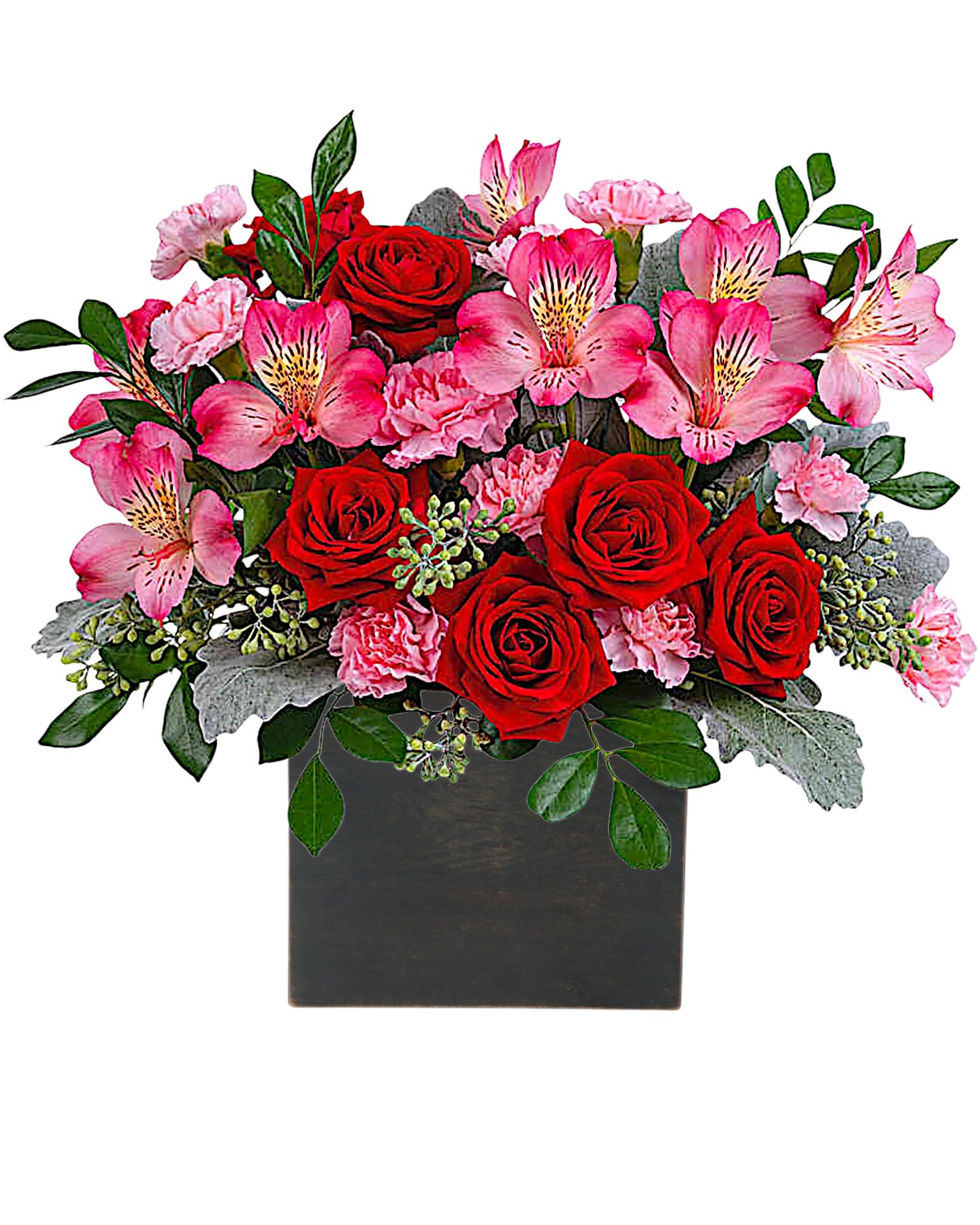 Red roses and pink flowers arranged in a black square vase