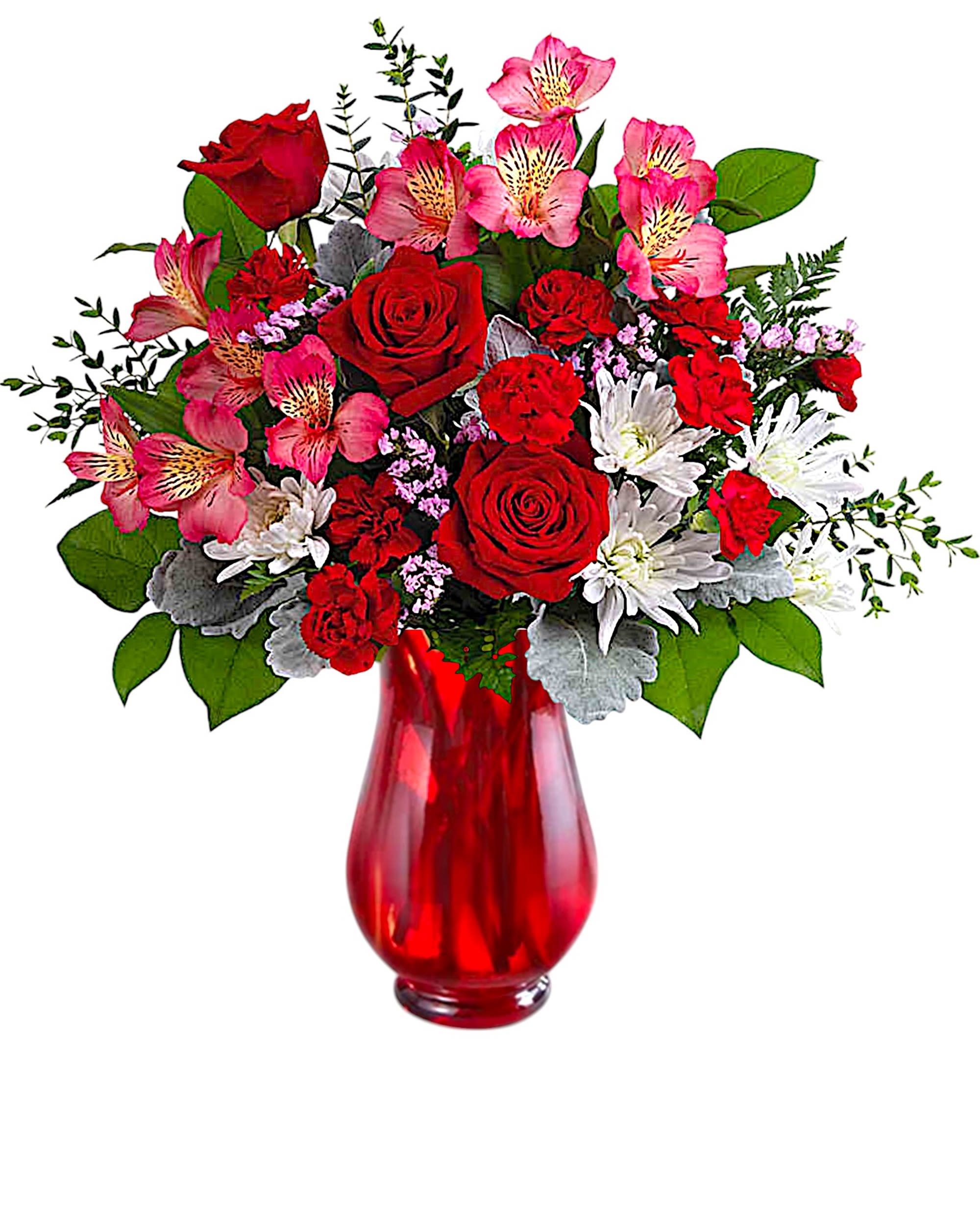 Red roses and pink alstroemeria in a red glass vase