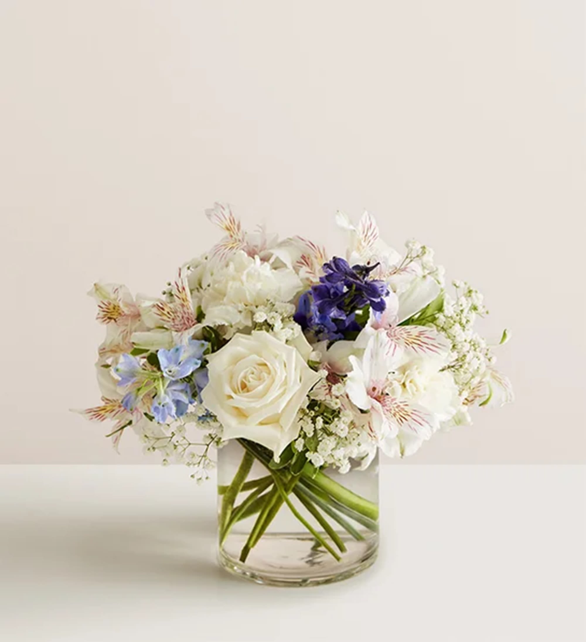 Loving Sentiments Blue &amp; White - A loving sentiment can bring comfort during a time of loss. The arrangement of blissful blue and white blooms is hand-designed to help you express your heartfelt condolences. Appropriate for the home, memorial reception, or other occasions.  DETAILS All-around arrangement with white roses, carnations and alstroemeria; blue delphinium and accented with baby’s breath. Artistically designed a clear glass cylinder vase  VASE INCLUDED Orientation: All-Around Item #NF-1322  FLORIST-TO-DOOR Same day flower delivery on most orders placed online by 12 pm or 10 am on weekends PST.  BLOOM DETAILS Roses Carnations Alstroemerias Delphinium Baby's Breath  The Standard Arrangement is approx. 12"H x 9"W The Deluxe Arrangement is approx. 12"H x 10"W The Premium Arrangement is approx. 12"H x 11"W  How to place an order? 1. You can place an order directly on this secure website OR 2. You can call in your order by dialing: (323) 262 - 9238 OR 3. You can visit our store (appointment recommended 323.262.9238)  NINFA'S FLOWERS 2405 WHITTIER BLVD. LOS ANGELES, CA. 90023  ATTENTION: *Please note that on busy holidays, Valentine's Day, and Mother's Day, we cannot verify if the recipient received the flowers until the following day. You can verify delivery on the website after 10:00 pm, call 323.262.9238 the following day after 10:00 am, or contact the recipient directly. Thank you for your patience and understanding.