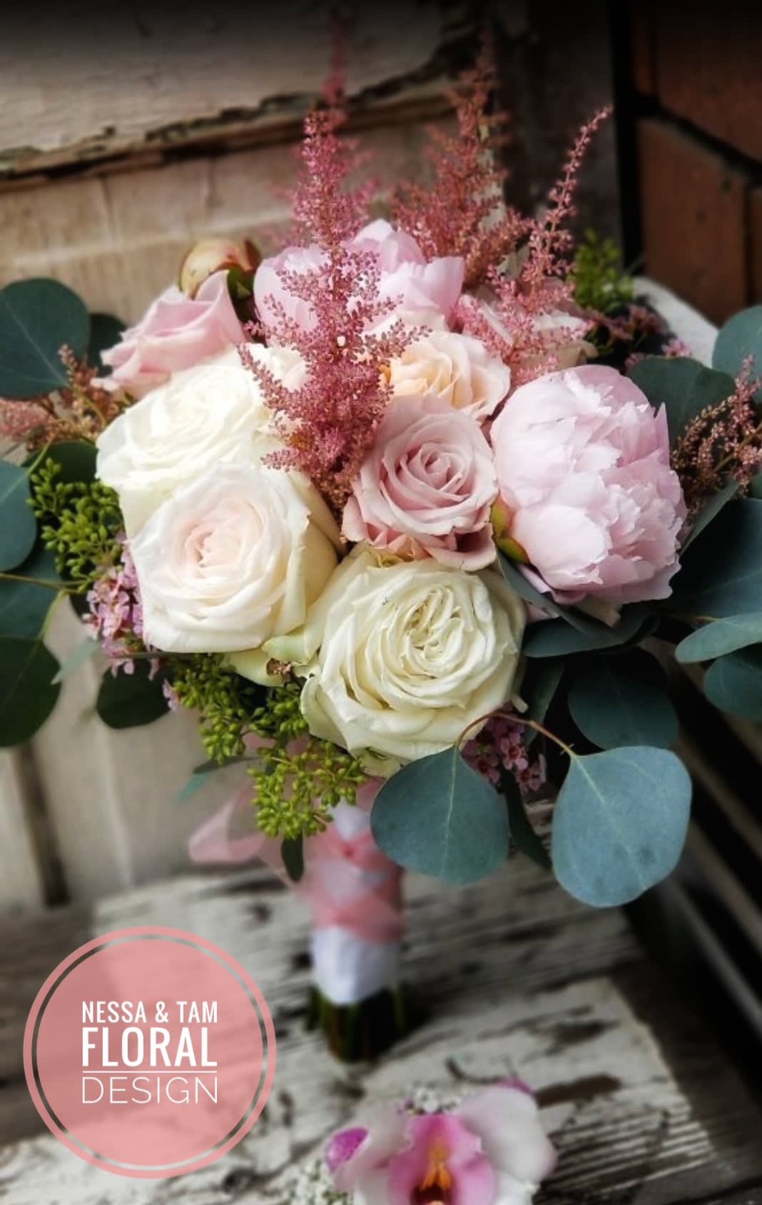 Bouquet of blush and white roses with pink filler and eucalyptus
