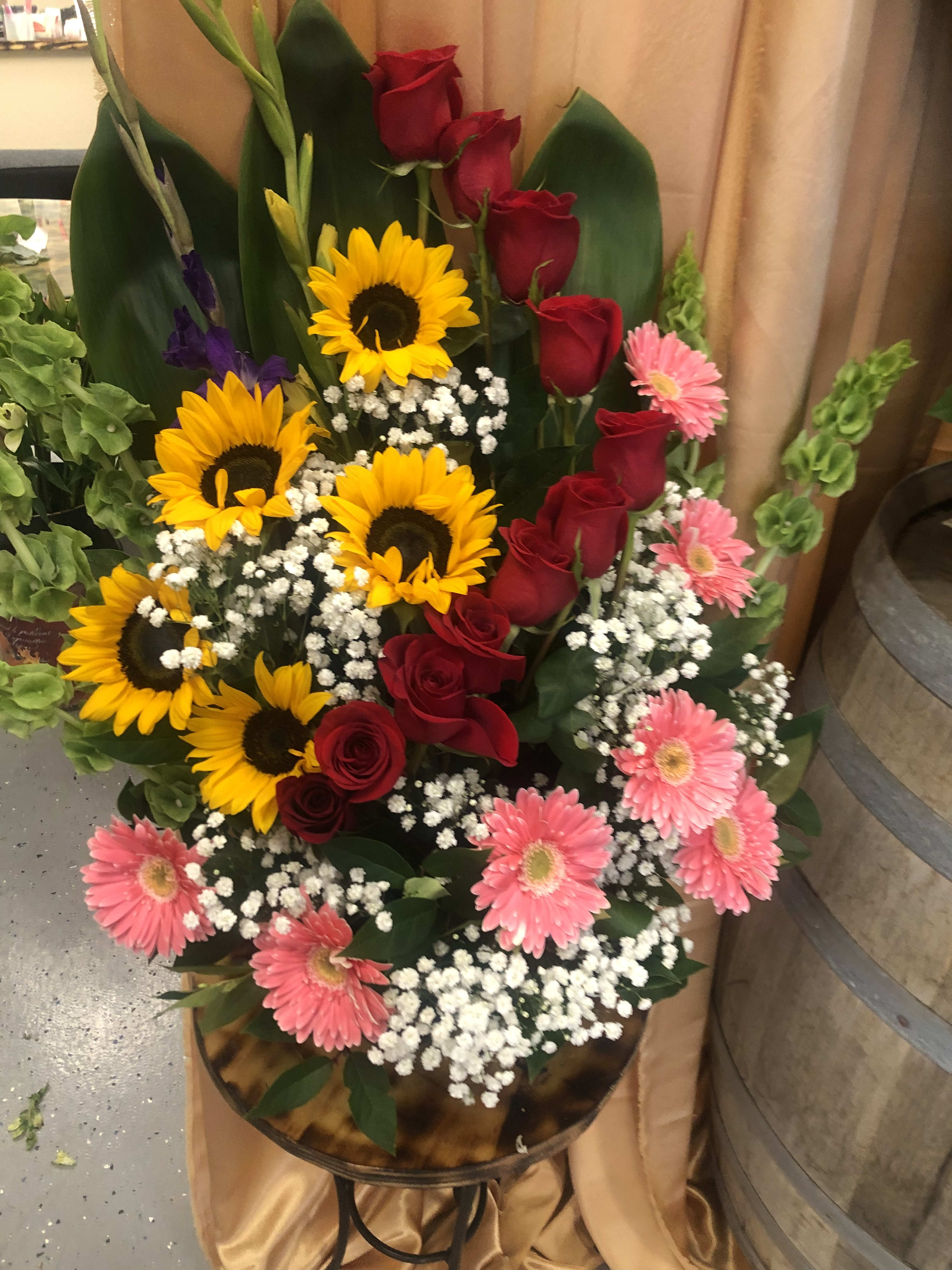 Basket of Garden - This basket is perfect for many occasions. Comes with Roses sunflowers and Gerbera Daises 