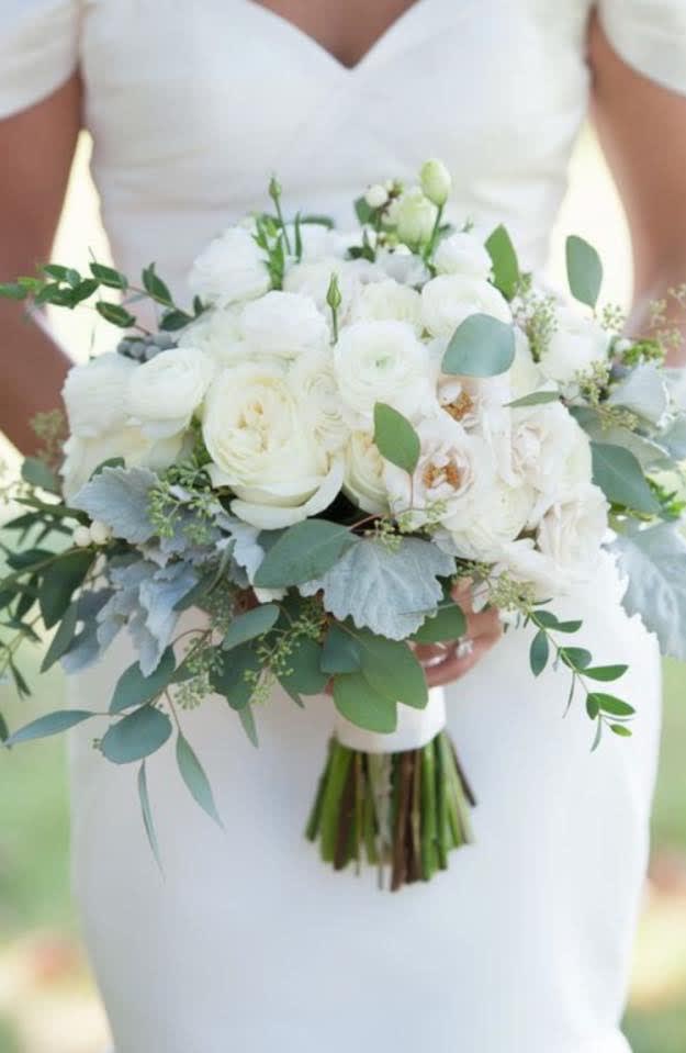 White bridal bouquet with eucalyptus and pale blue foliage