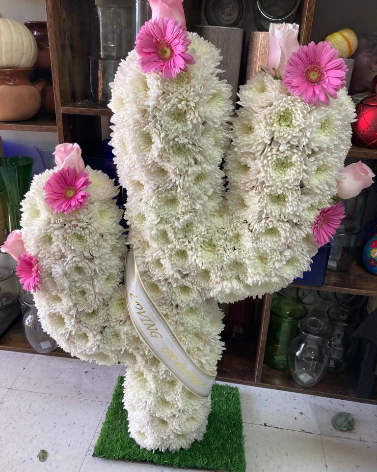 White chrysanthemum standing spray with pink gerbera daisies