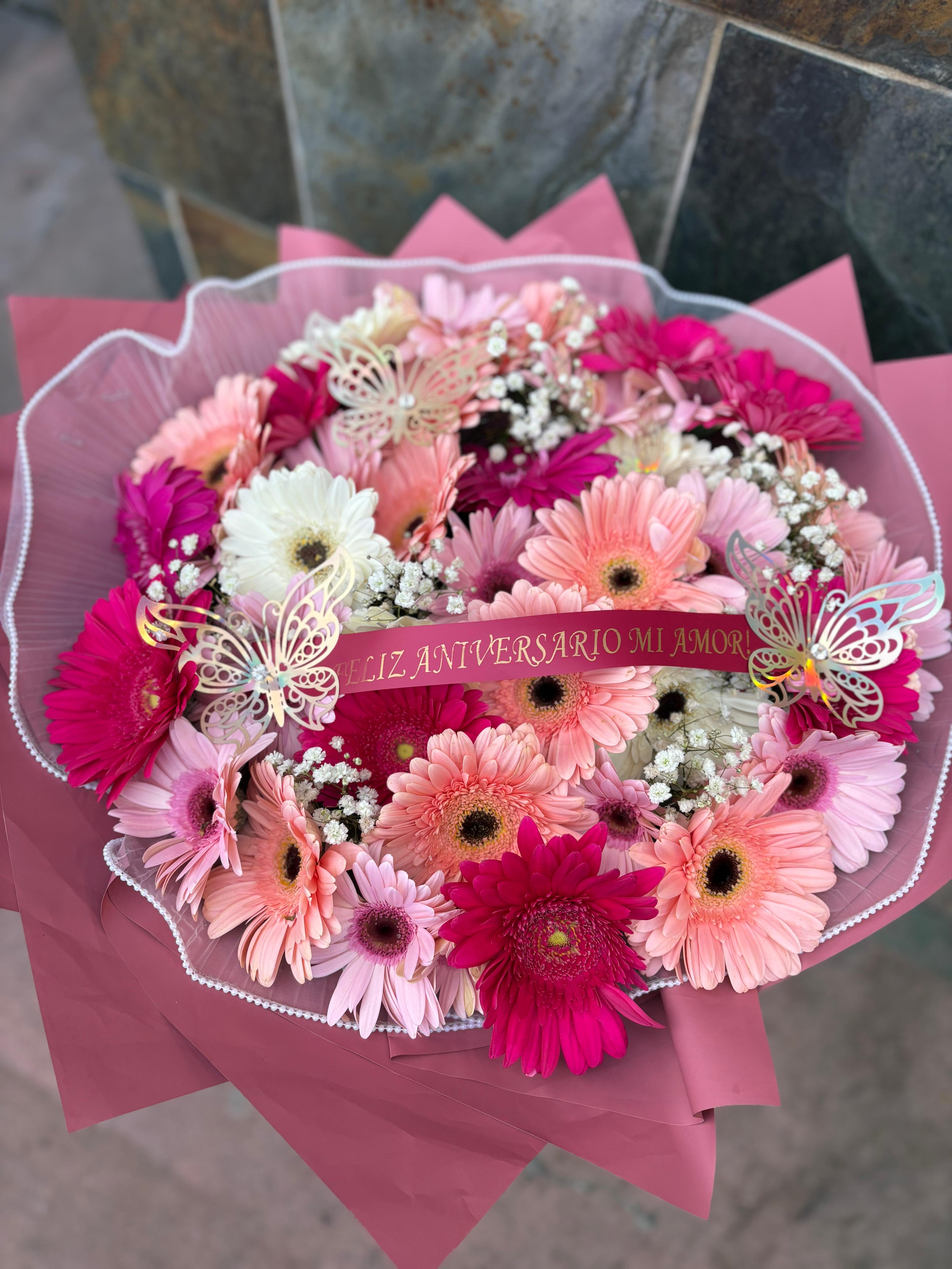Pink and white gerbera daisy bouquet with a anniversary ribbon