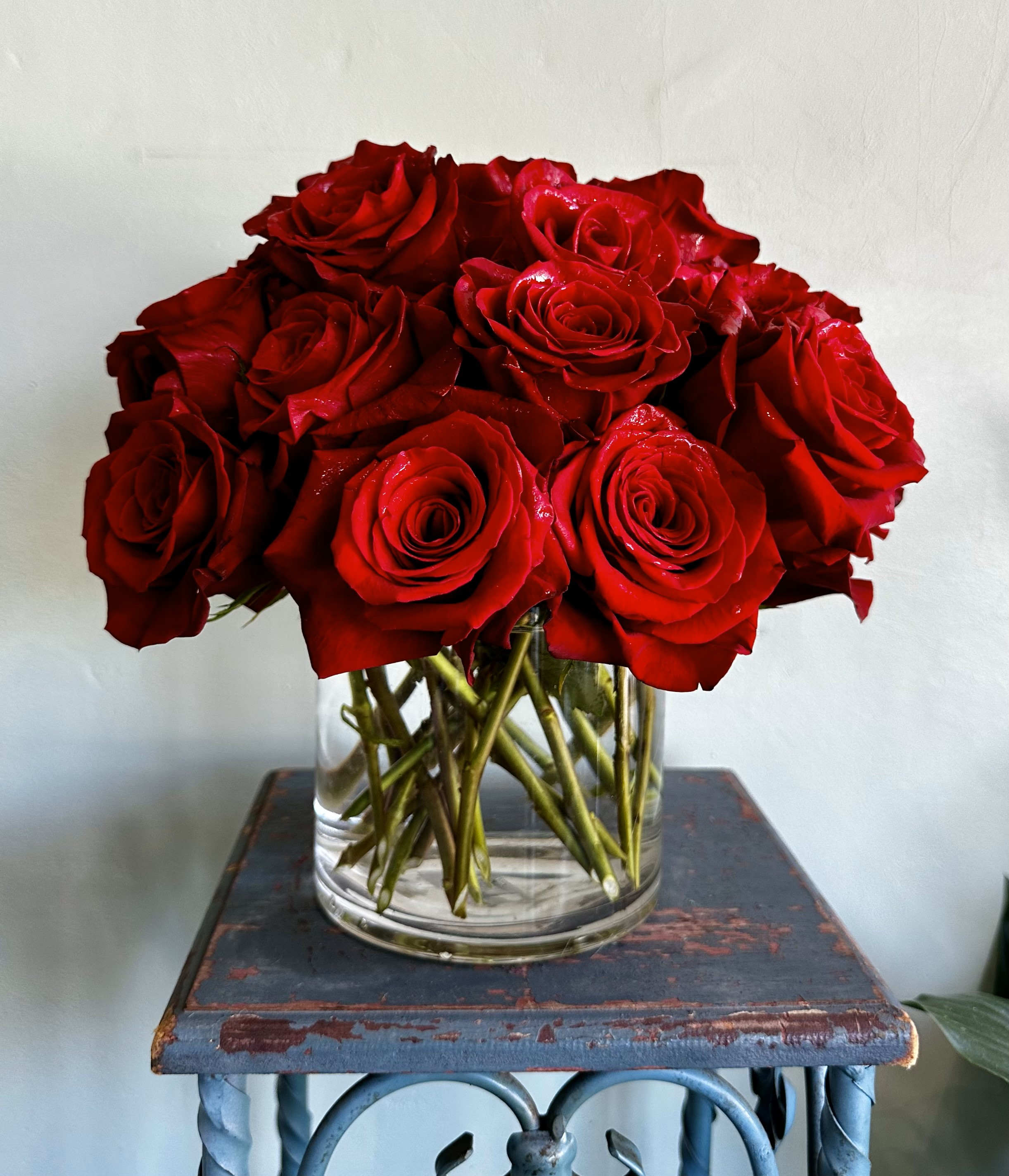 Lover - Make a bold statement with this beautifully simple design. Lover is the perfect gift for Valentine's Day, an Anniversary, or when anytime you're feeling romantic.   Arrangement Details: Three dozen red roses in a glass cylinder vase.  APPROXIMATE DIMENSIONS are 12"D X 12"H 
