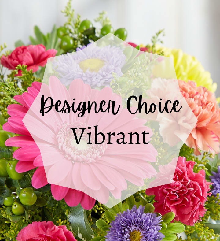 Bright mixed bouquet with pink gerbera daisy, carnations, and other colorful blooms with Designer Choice Vibrant text