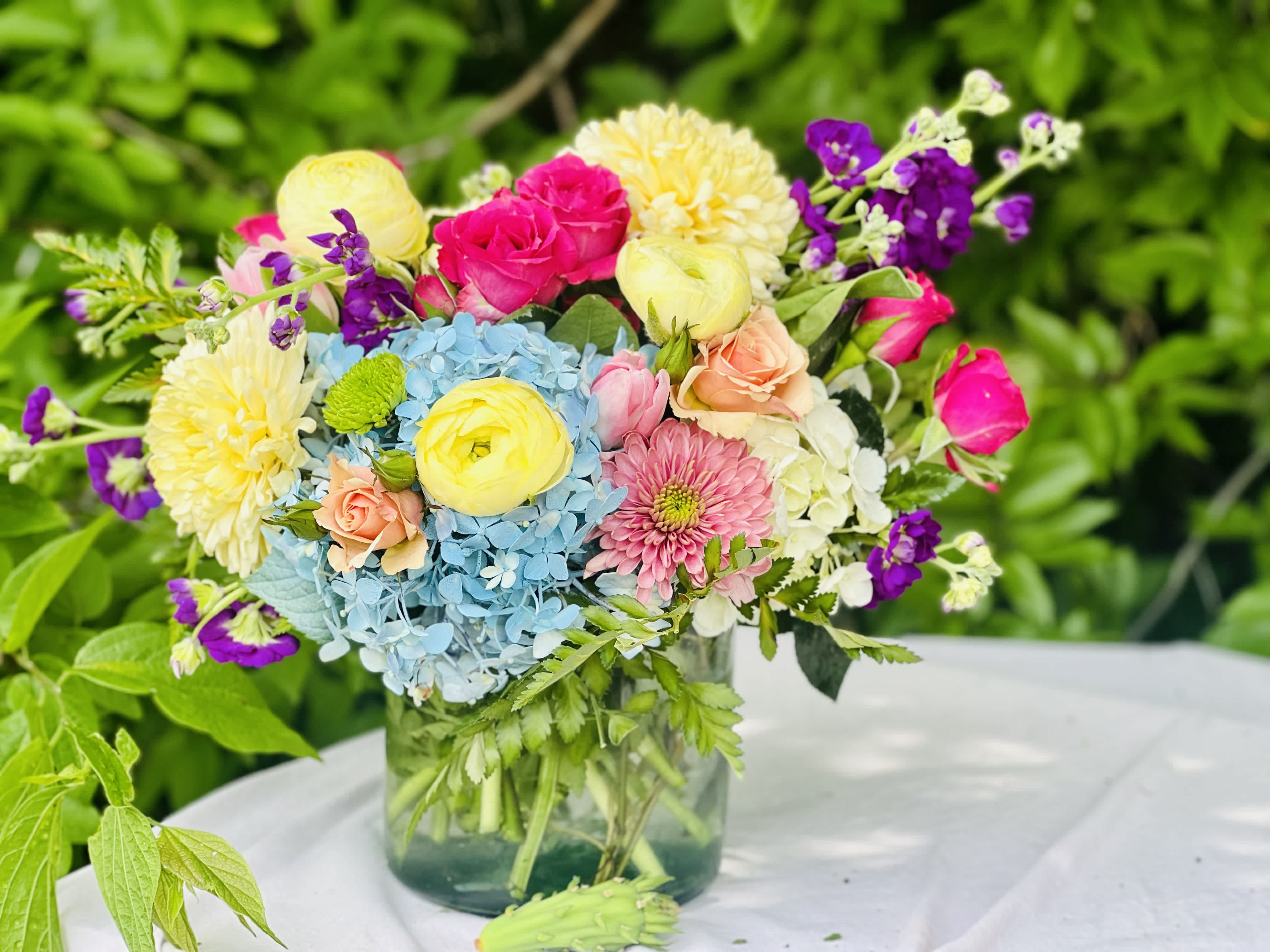 Colorful mixed bouquet in a clear glass vase