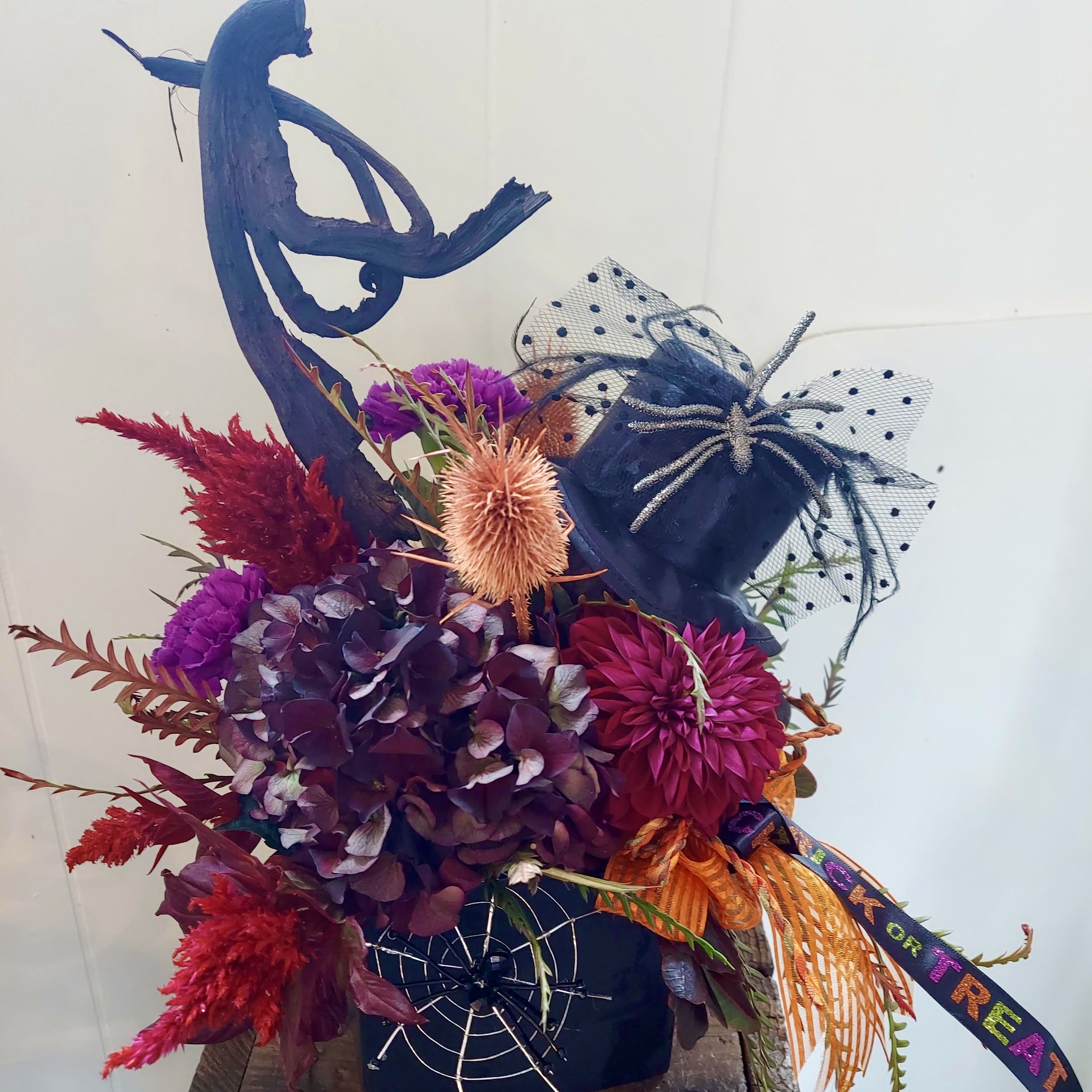 Gloomy Blooms - This Custom Creation by Carrie is anything but Gloomy.  Delight your Trick or Treat celebrations with this dramatic, moody and, oh so gloomy, centerpiece.  