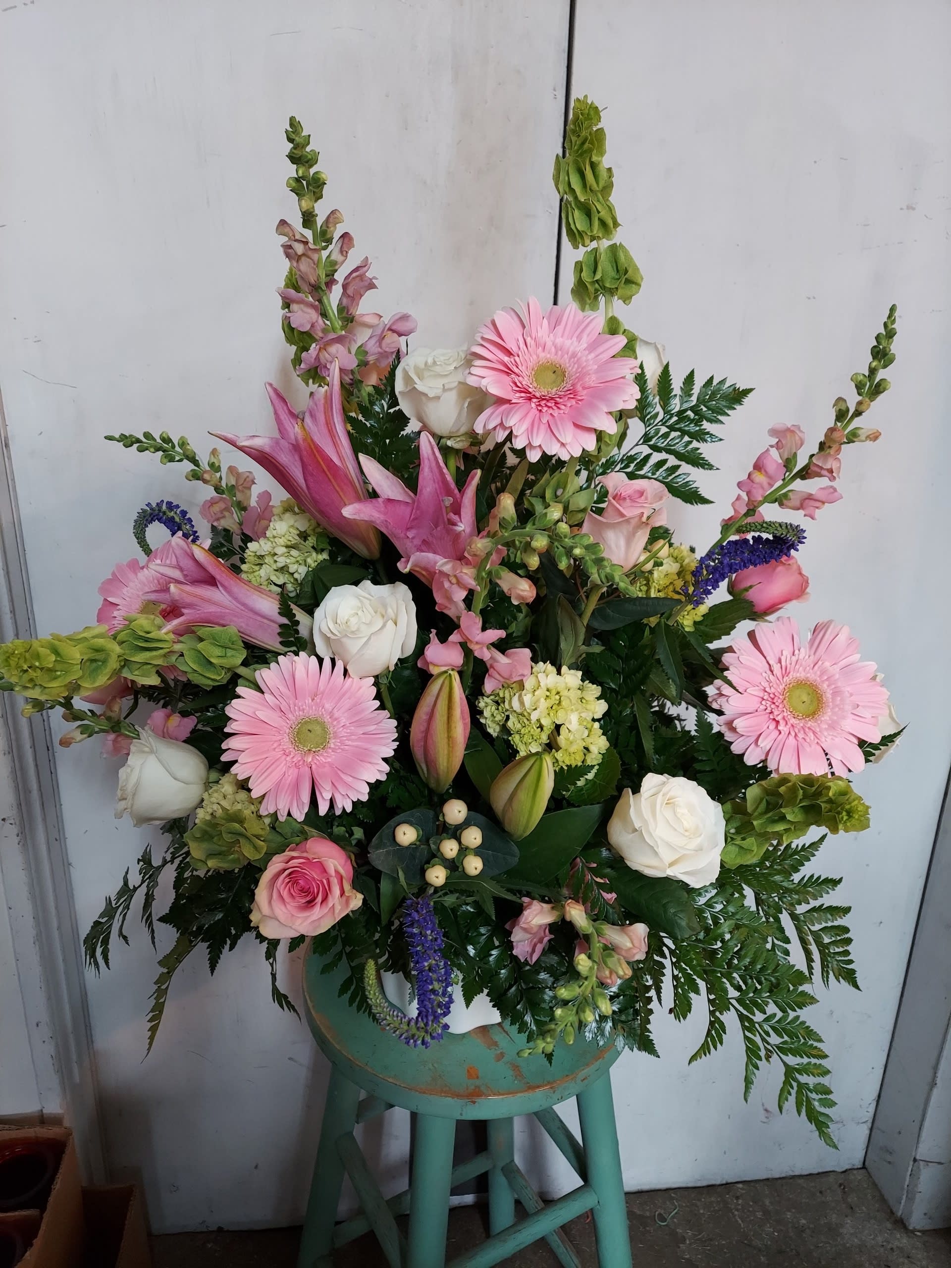 Pink and white mixed flower arrangement in a vase