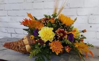 Sunnyside Gardens Cornucopia  - Just in time for your Thanksgiving Celebration.  An abundant supply of good things in a festive wicker basket makes the perfect Thanksgiving centerpiece.  Order now while supplies last!