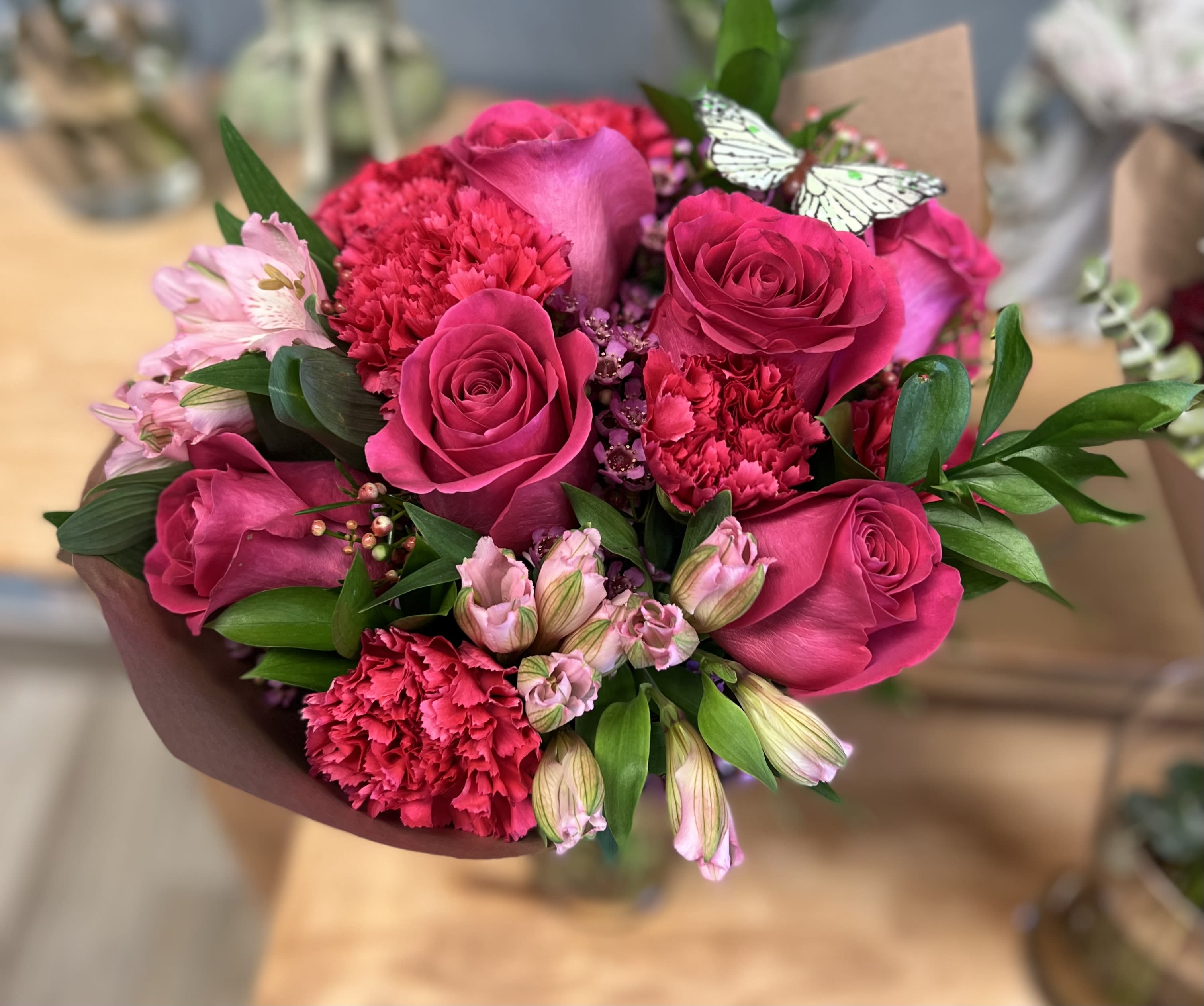 Bouquet of hot pink roses, carnations, and pale pink alstroemeria