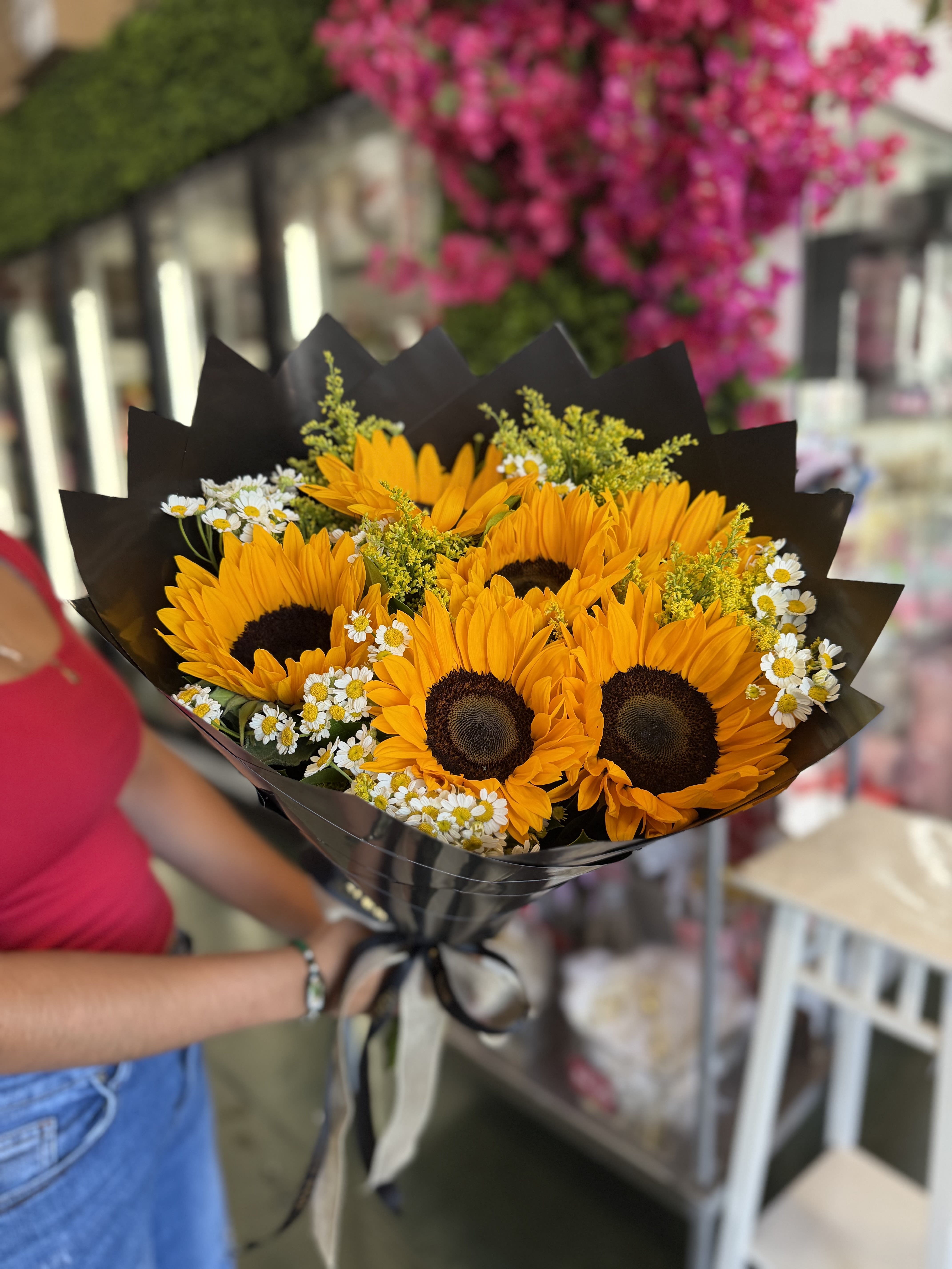 Sunflowers Bouquet - Included: Sunflowers, Greenery, Fillers, Paper. Standard 6 Sunflowers.//  Deluxe 12 Sunflowers.// You may request change in color paper during checkout under instructions. 