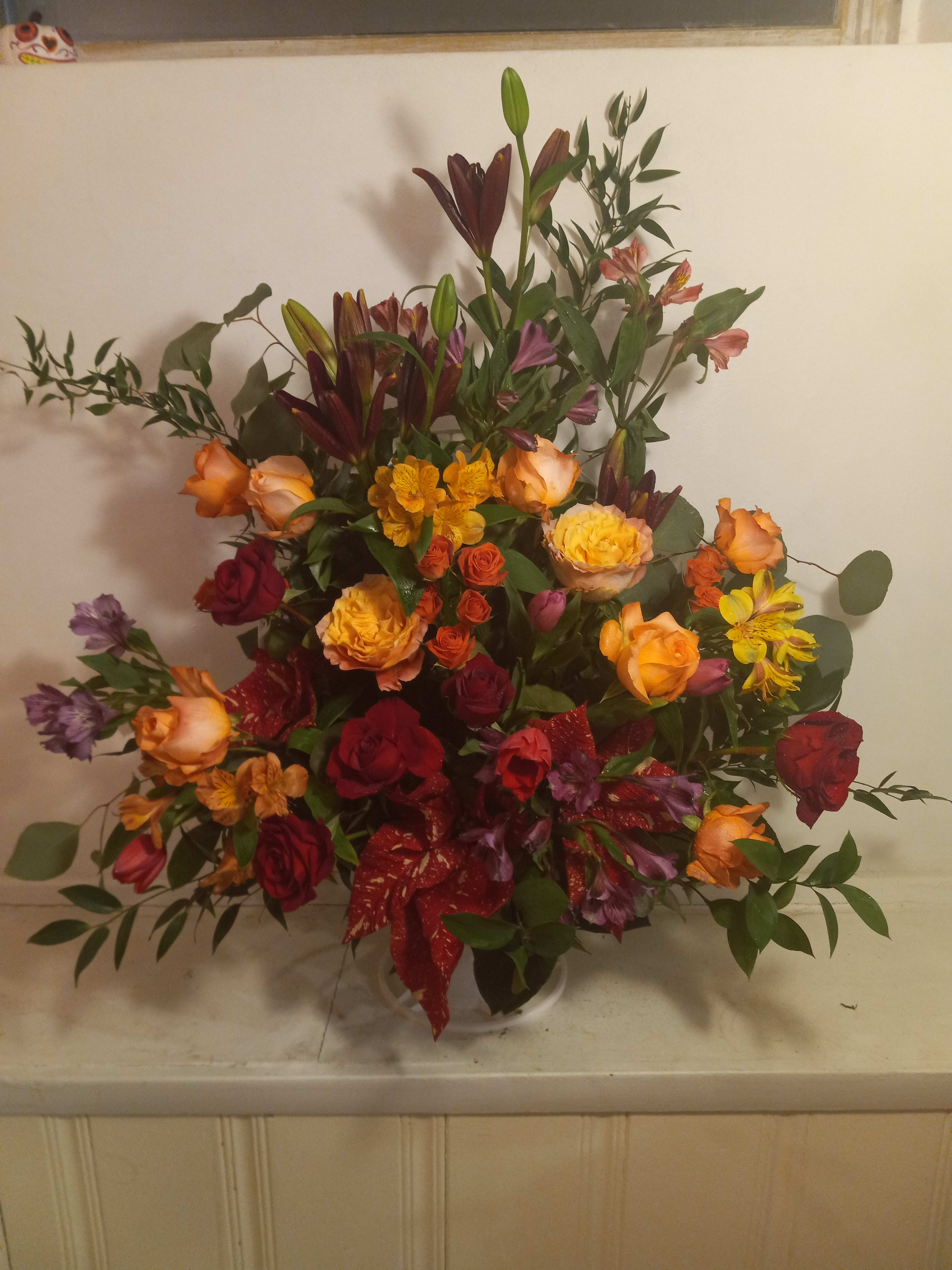 Large mixed bouquet with roses, lilies, and alstroemeria in a vase