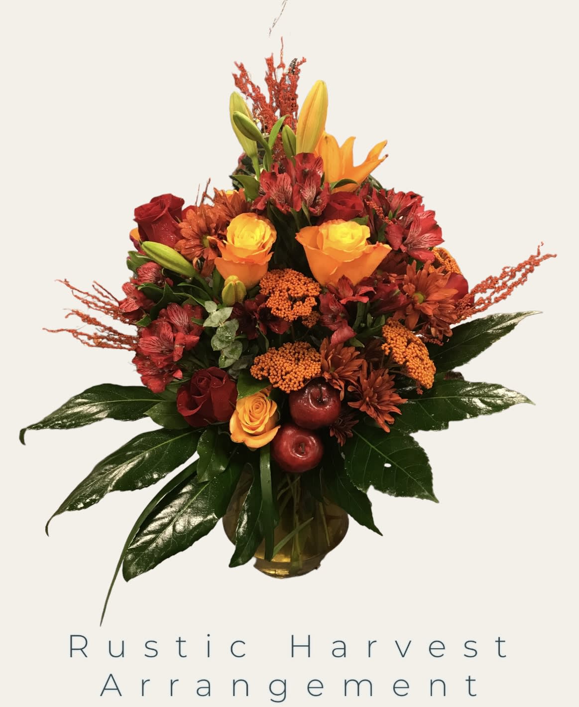 Rustic bouquet of red, orange, and yellow flowers in a vase