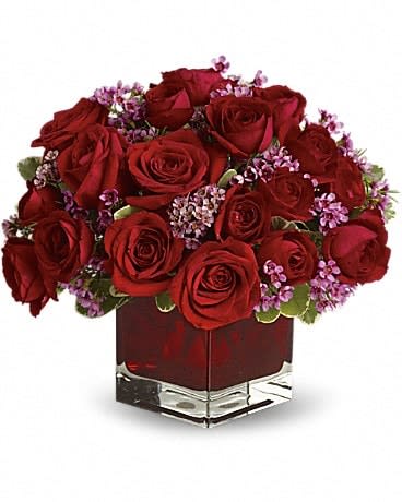 Never Let Go - 18 Red Roses - Let someone special know how much their love means to you by sending them this truly original arrangement. A vision in red with lavender accents, this beautiful gift is a poignant way to celebrate love that endures. Eighteen pretty red roses with lavender waxflower and greens are delivered in a stunning ruby red cube vase. 