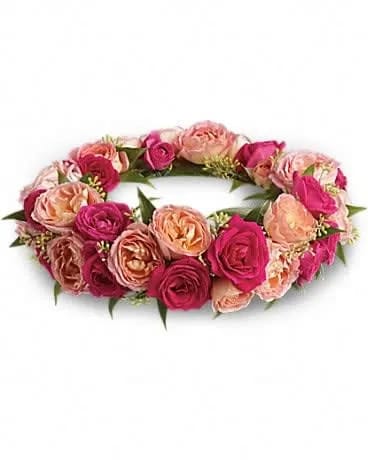 Queen's Garden Crown - She'll feel like royalty in this gorgeous crown of pink roses. A crown of pink and hot pink roses with accents of seeded eucalyptus and Italian ruscus. 