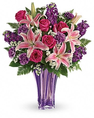 Pink lilies and roses in a purple vase