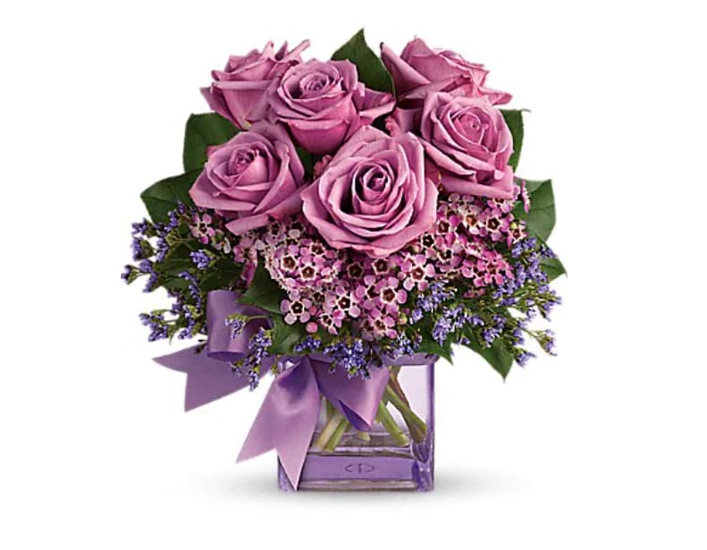 Morning Melody - Shades of purple are in perfect harmony in this profoundly pretty arrangement. A lovely mix of classic and modern, ribbons and roses, it's sure to make someone's day! Lavender roses and waxflower, purple limonium and greens are hand-delivered in a lavender cube that's all wrapped up with a vibrant purple taffeta ribbon.   Orientation : One-Sided  All prices in USD ($)  Standard  T68-3A  Deluxe  T68-3B  Premium  T68-3C