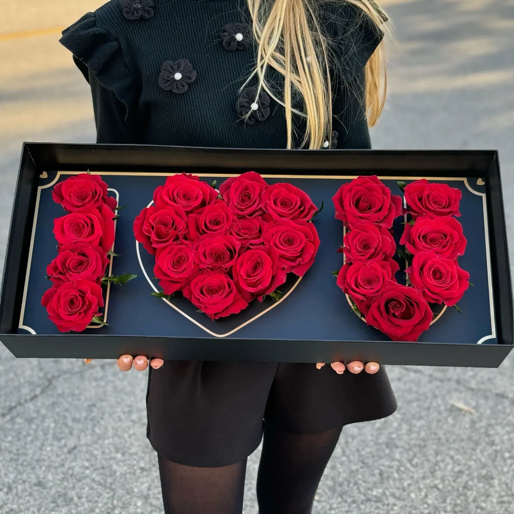 Boxed red roses arranged as the number 10
