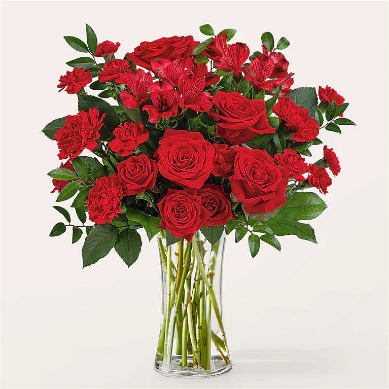 Brilliant Ruby Bouquet  - A vibrant selection of red florals are the way to go when expressing romance, admiration, or simply looking for a show-stopping present.  Bloom Details Rose Alstroemeria Carnation
