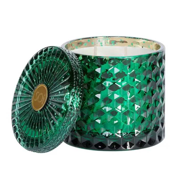 Green faceted glass candle jar with a matching lid